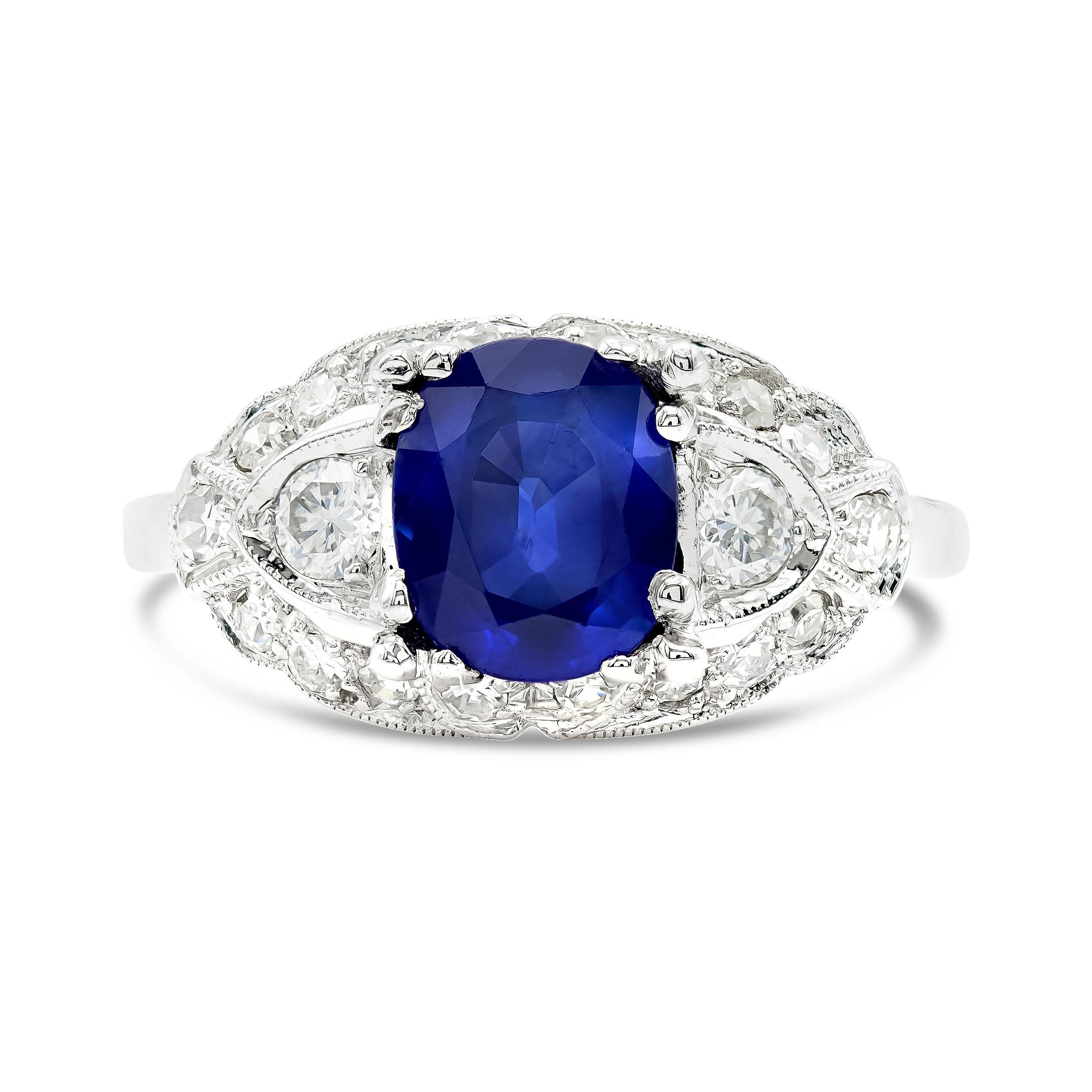 Here's a cool take on an art deco ring, starring a very beautiful 1.55 carat natural sapphire. The center gem's blue color is elevated by 20 accenting diamonds set in super sleek platinum. The frame style setting is a deco-era favorite and we love