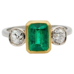 Antique Art Deco 1.55 Carat Colombian Emerald 1.20 Old Mine Diamond Three-Stone Ring
