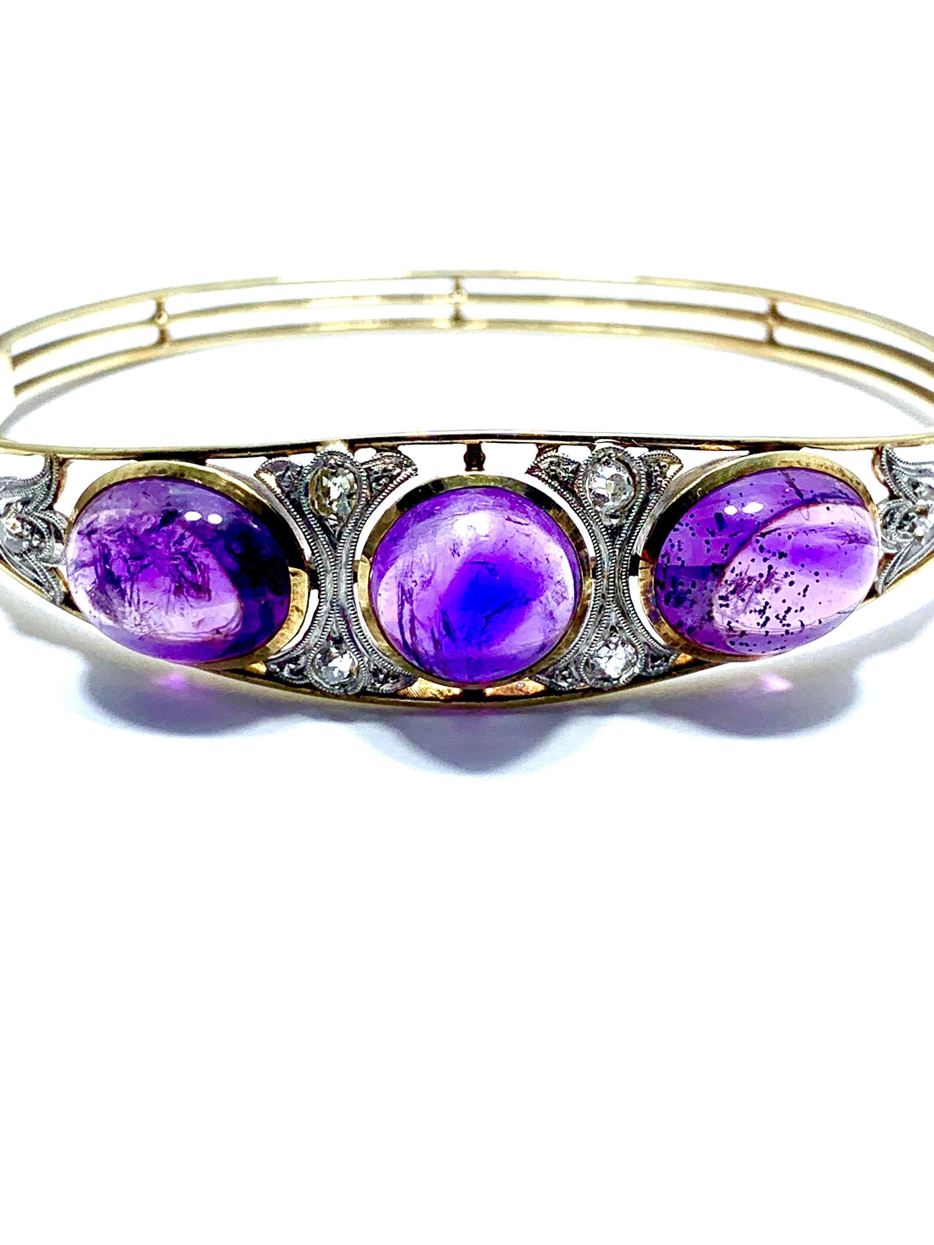 An amazing Art Deco Style cabochon Amethyst and Diamond bracelet!  The three cabochon Amethyst have a total weight of 15.60cts, and they are bezel set in 14K yellow gold, with white gold filigree and diamonds in between each stone.  The Amethyst and