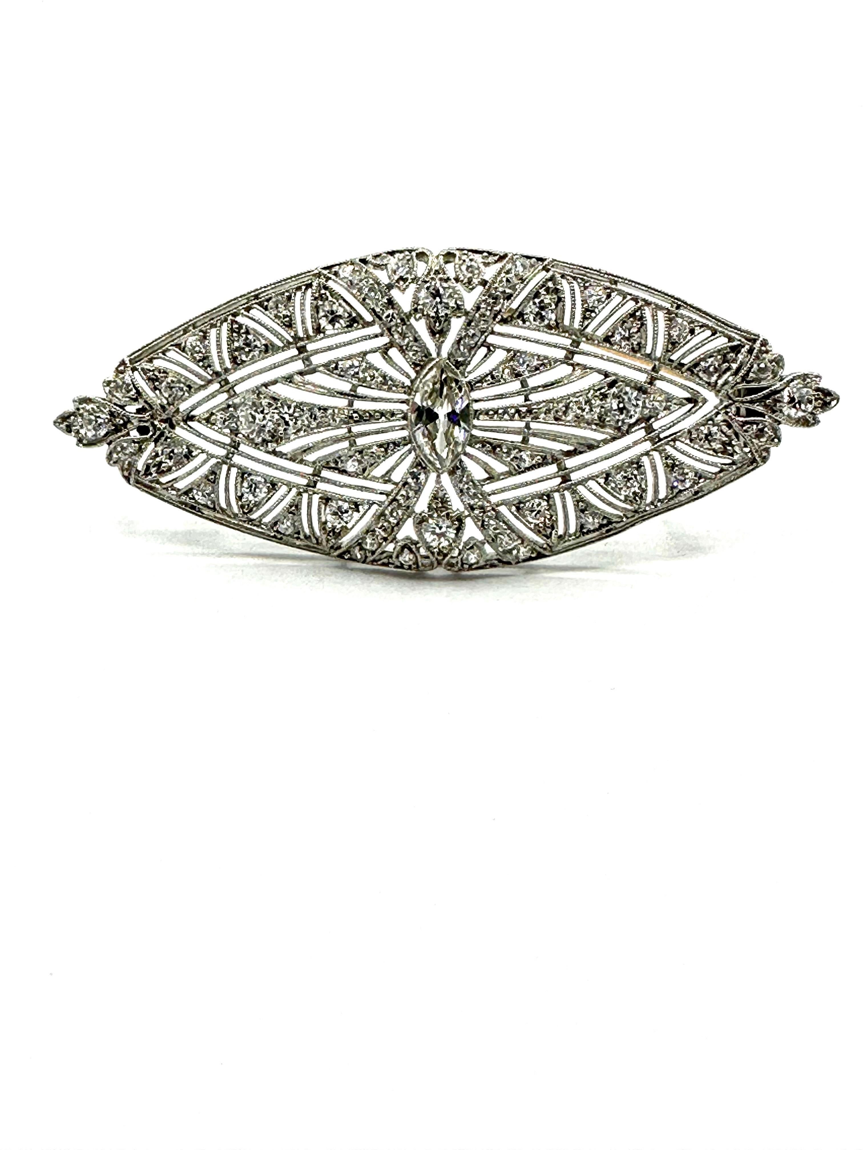 A simple and elegant Art Deco brooch.  The brooch has a center bezel set old European cut marquise Diamond.  The marquise is set with 74 old European cut and single cut Diamonds throughout the rest of the brooch.  The brooch contains a single pin