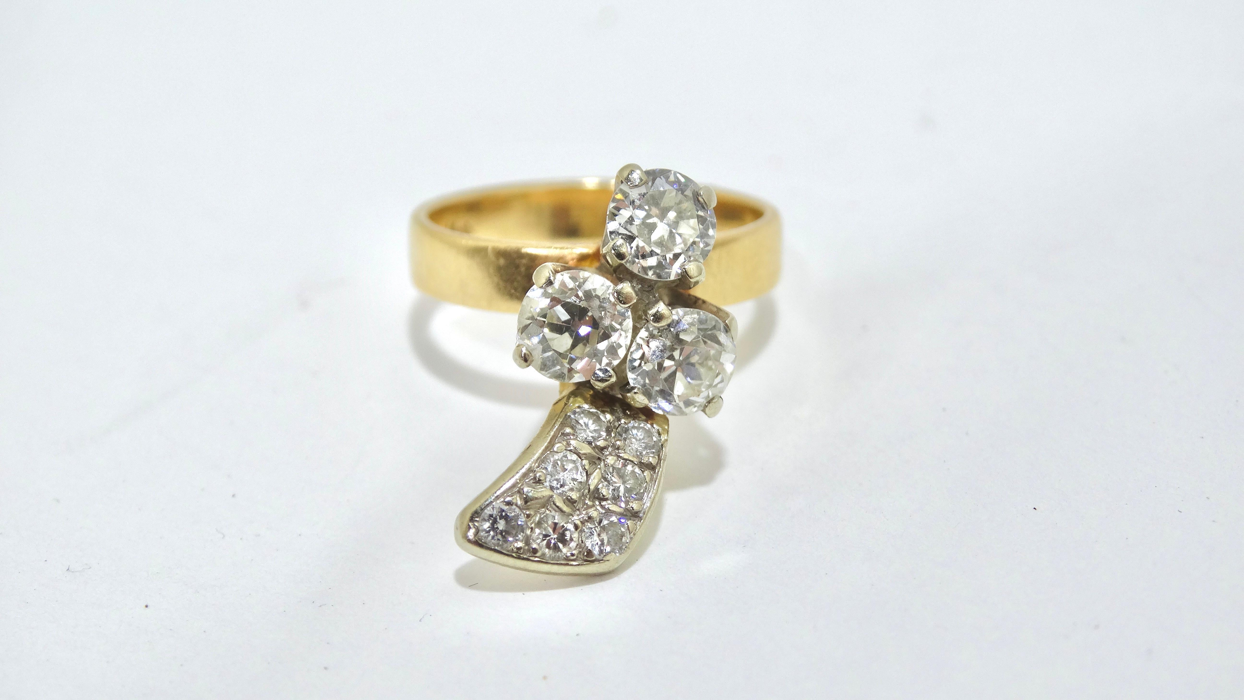 Don't miss your chance to snag a beautifully unique piece. Made up of around 1.5ct diamonds formed in an extremely unique shape, 14k gold ring. Pair with other rings to create a layered look and a Fendi monogrammed top. 3 center stones are a total