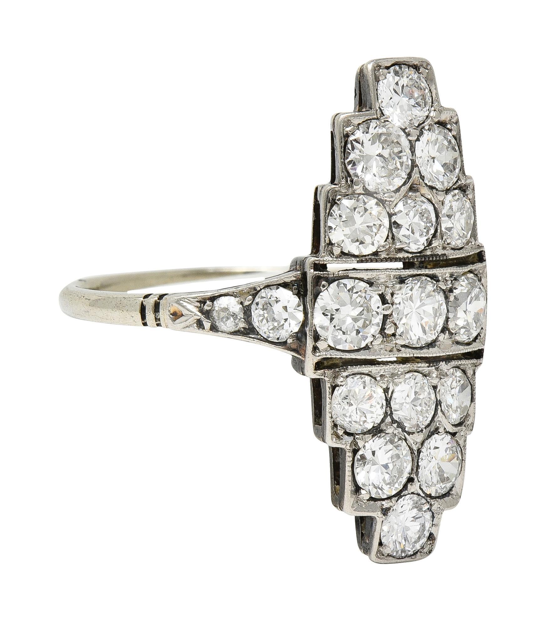 Designed as a navette-shaped form with pierced detail and stepped edges
With milgrain detail and flanked by flaring shoulders with grooved accents
Bead set throughout with old European and transitional cut diamonds 
Weighing approximately 1.60