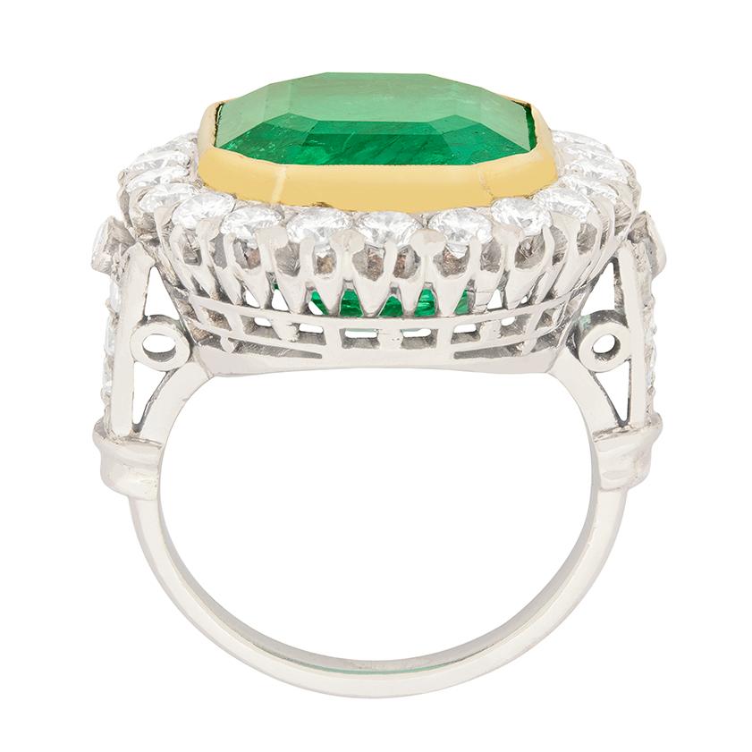This absolutely breath-taking Art Deco Emerald ring is definitely one to be admired. With a simply stunning centre Emerald, origin Colombian and a lovely sea green colour to it, it has been certified by The Gem & Pearl Lab as moderately enhanced. It
