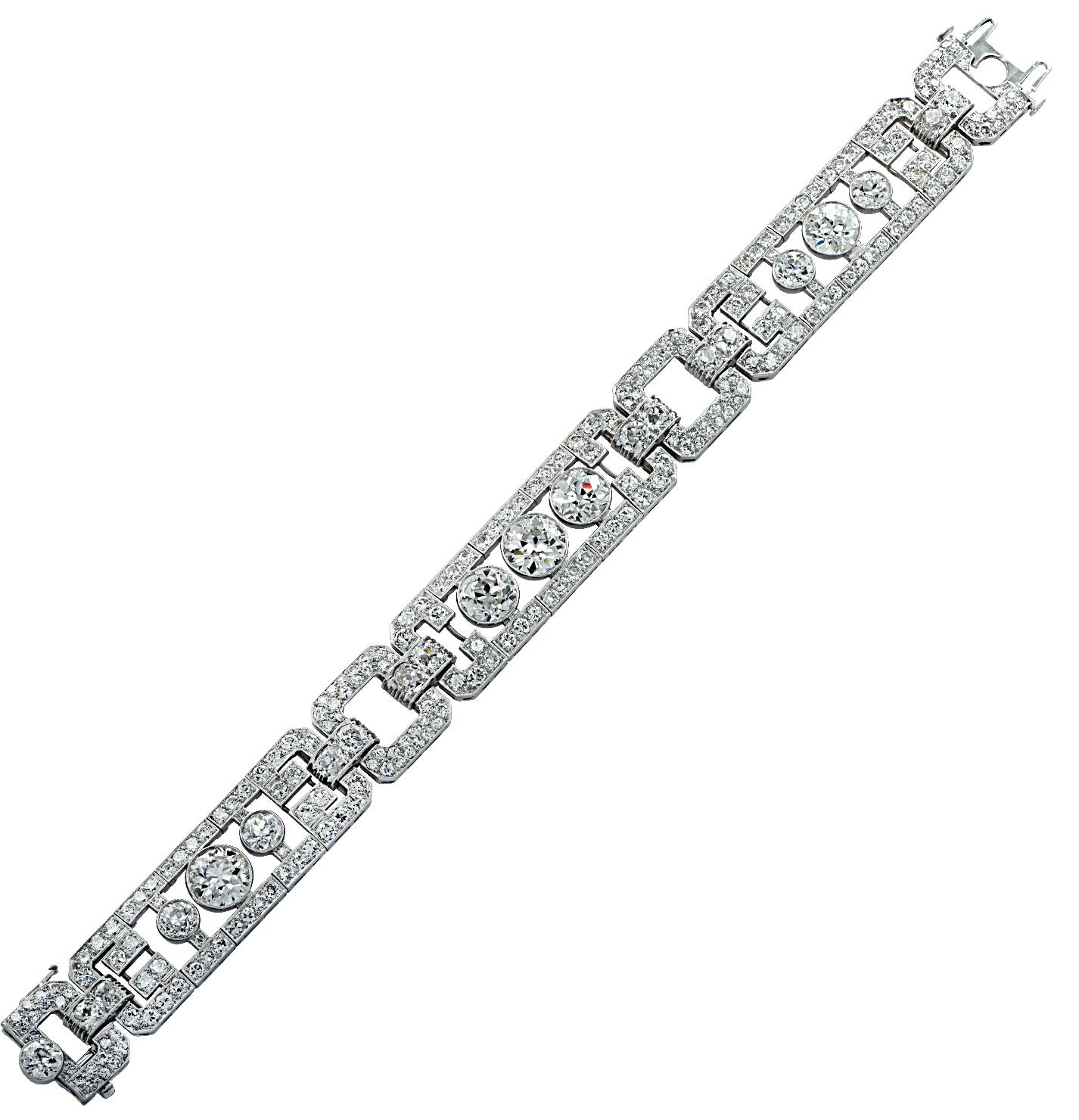Spectacular Art Deco bracelet crafted in platinum, featuring 228 Old European Cut Diamonds weighing approximately 16.32 carats total, G-J color, VS-SI clarity. The bracelet has 3 articulated diamond encrusted openwork plates, each showcasing three