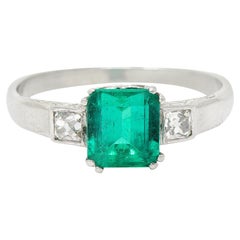 Art Deco 1.65 Carats Emerald Diamond Platinum Three Stone Ring