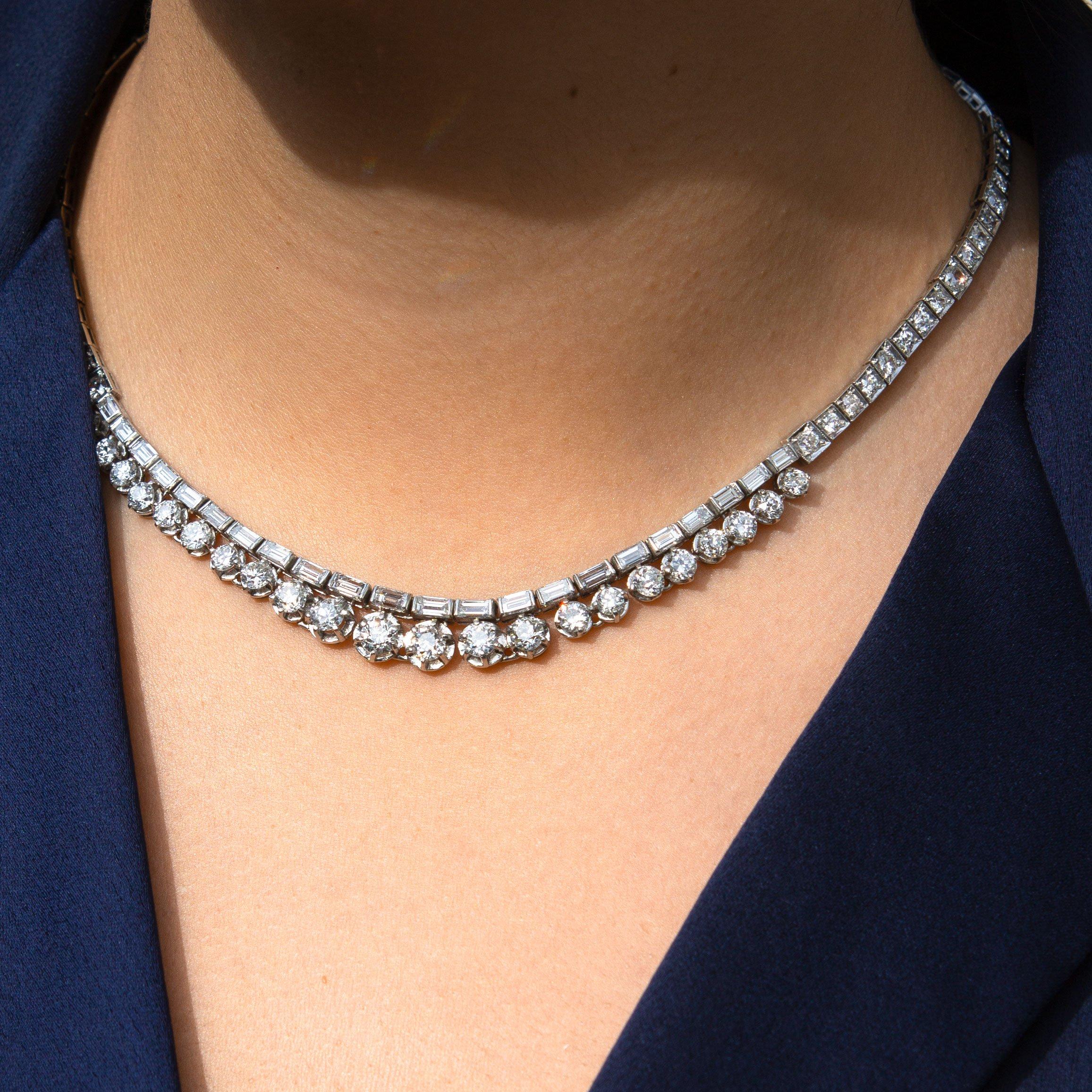 This is a jewelry piece that needs no introduction. The magnificent Art Deco era diamond necklace packs a hefty amount of sparkle, almost 17 carats worth to be exact. A string of old European cut diamonds and straight baguettes practically float