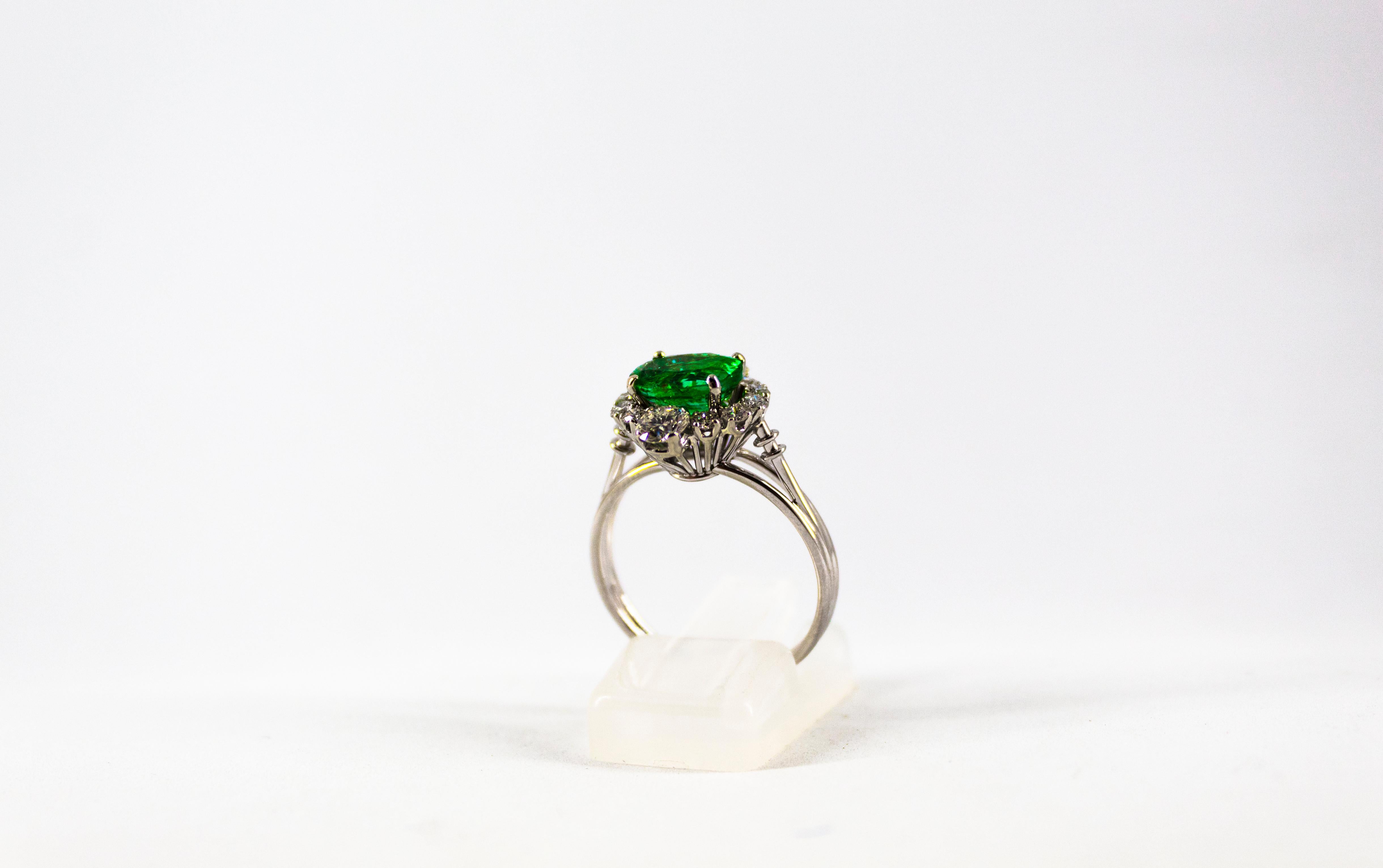 Art Deco 1.68 Carat Emerald 1.25 Carat White Diamond White Cocktail Ring 1