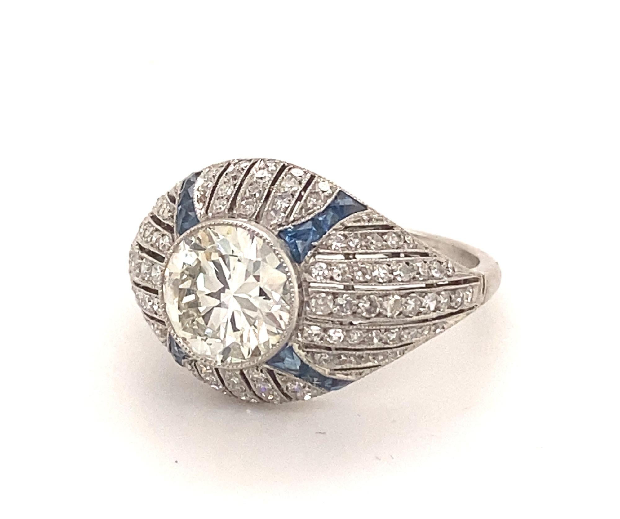 Round Cut Art Deco Style 1.68 Center Diamond Platinum Sapphires Engagement Ring For Sale