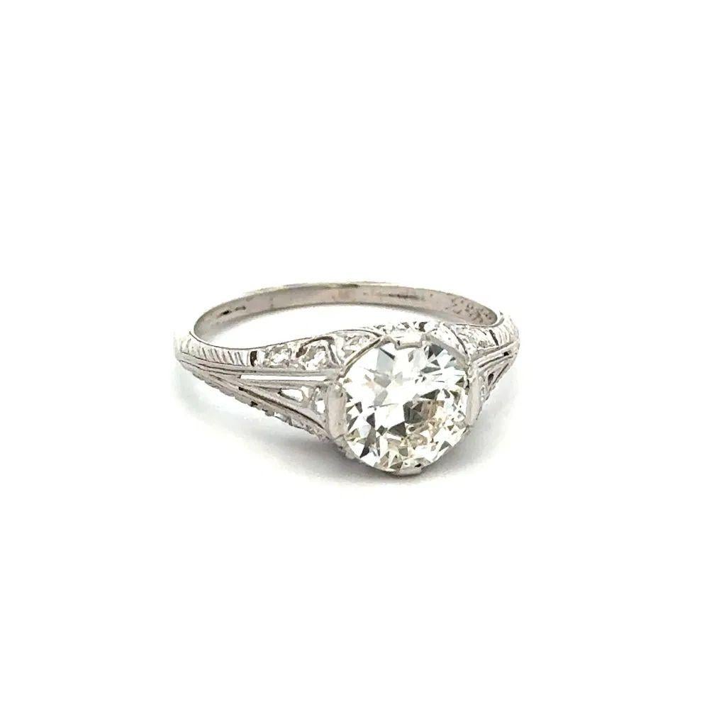 Simply Beautiful! Art Deco Diamond Solitaire Platinum Ring, securely nestled with a Hand set Old European Cut Diamond weighing approx. 1.69 Carat. Accented by Diamonds, approx.  0.34tcw. Hand crafted Filigree Platinum mounting. Ring Size 7.5, we