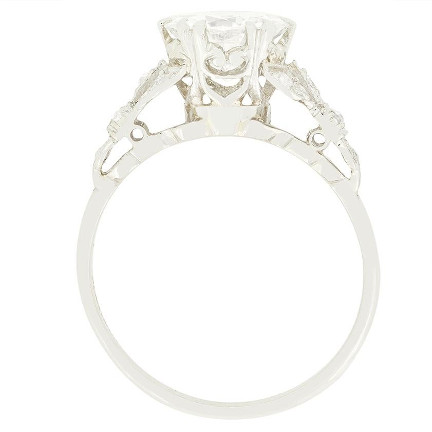 This beautiful Art Deco take on the classic solitaire design was hand crafted in the 1930s. At it’s centre sits a sparkling 1.70 carat transitional cut diamond. The diamond has been given a colour of between G and H and a clarity of SI1. The diamond
