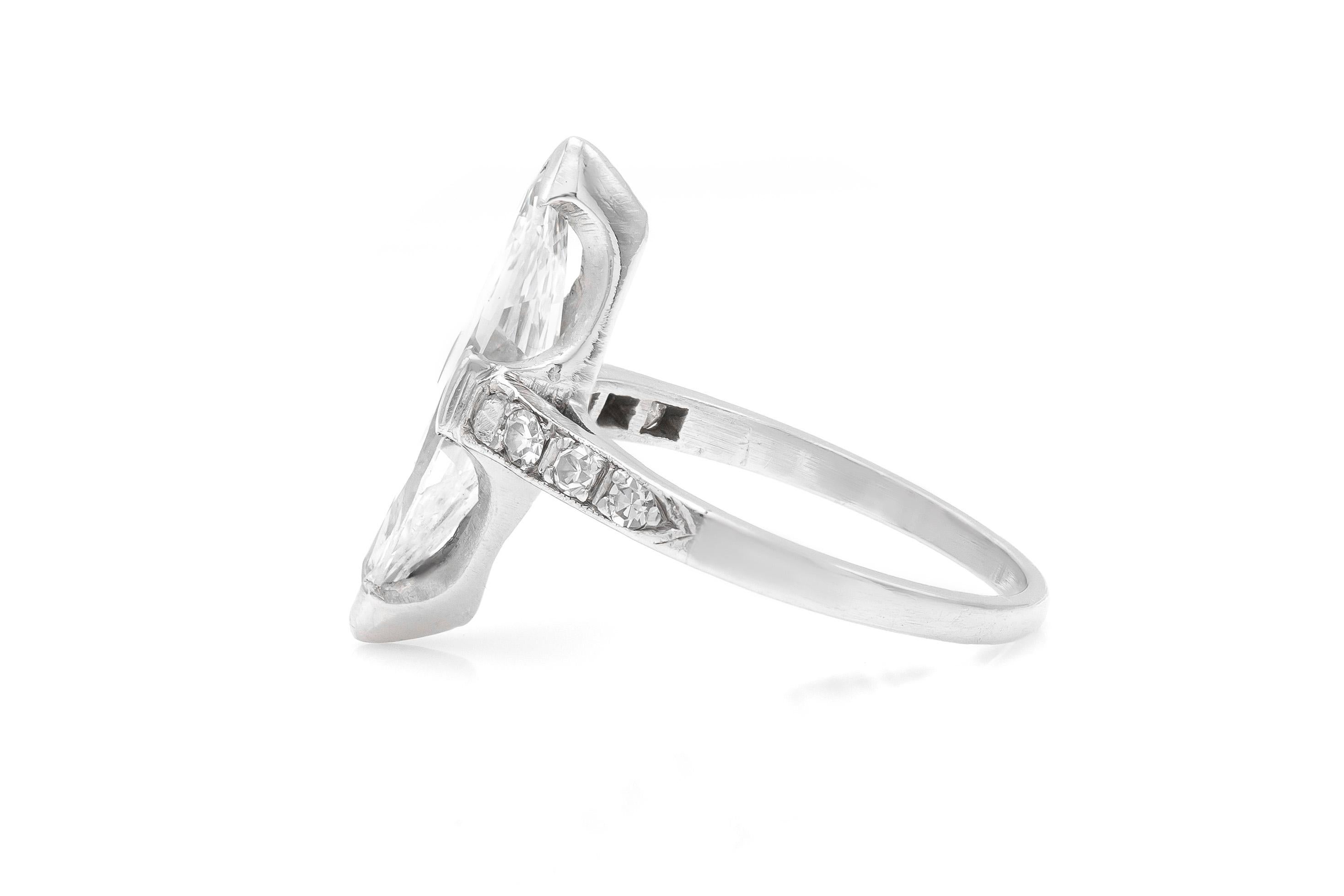 Finely crafted in platinum with a GIA certified Marquise cut center diamond, weighing 1.74 carats.
Color K    Clarity VS1
The ring features round brilliant cut diamonds on the band.
Art Deco