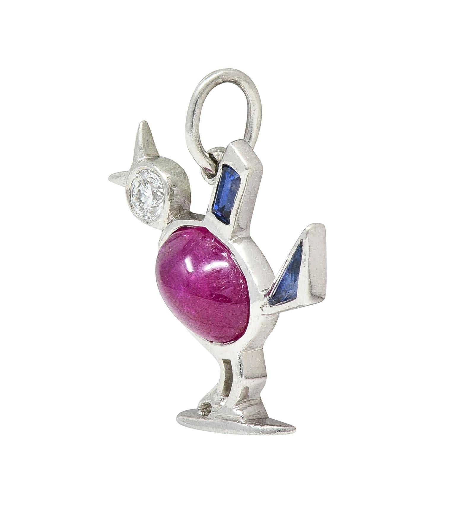 Designed as a stylized bird with a ruby cabochon body
Oval-shaped and weighing approximately 1.54 carats
Transparent medium red in color and bezel set
With a bezel set transitional cut diamond head
Weighing approximately 0.08 carat - eye clean and