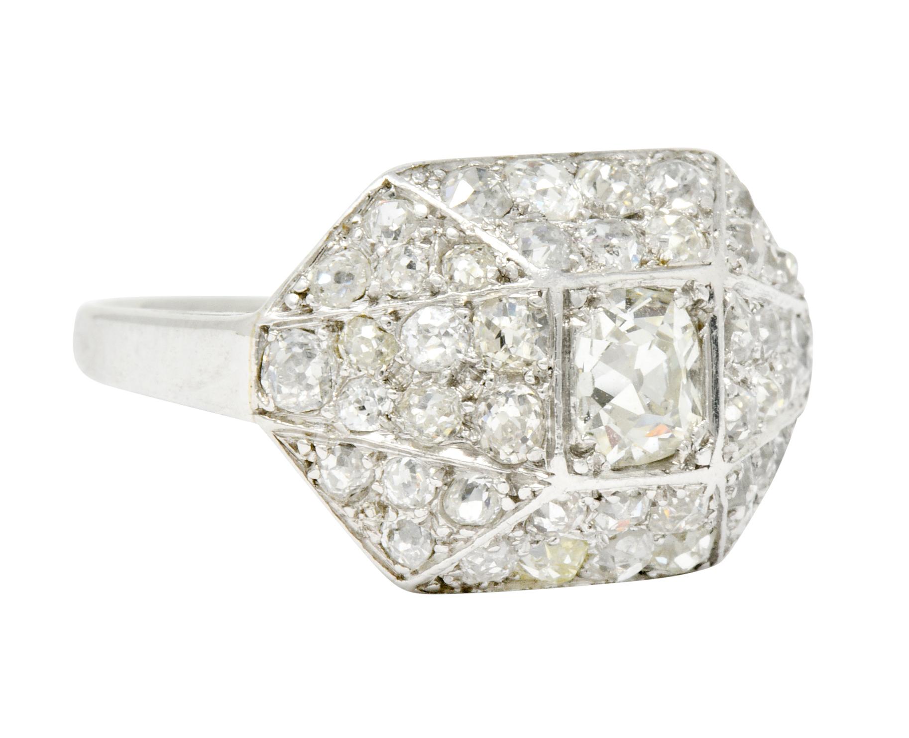 Dinner style ring designed as an elongated pyramidal form

Centering an old mine cut diamond, set in a recessed square form head, weighing 
approximately 0.50 carat; F color with VS clarity

Surrounded by pave set old mine cut diamonds weighing