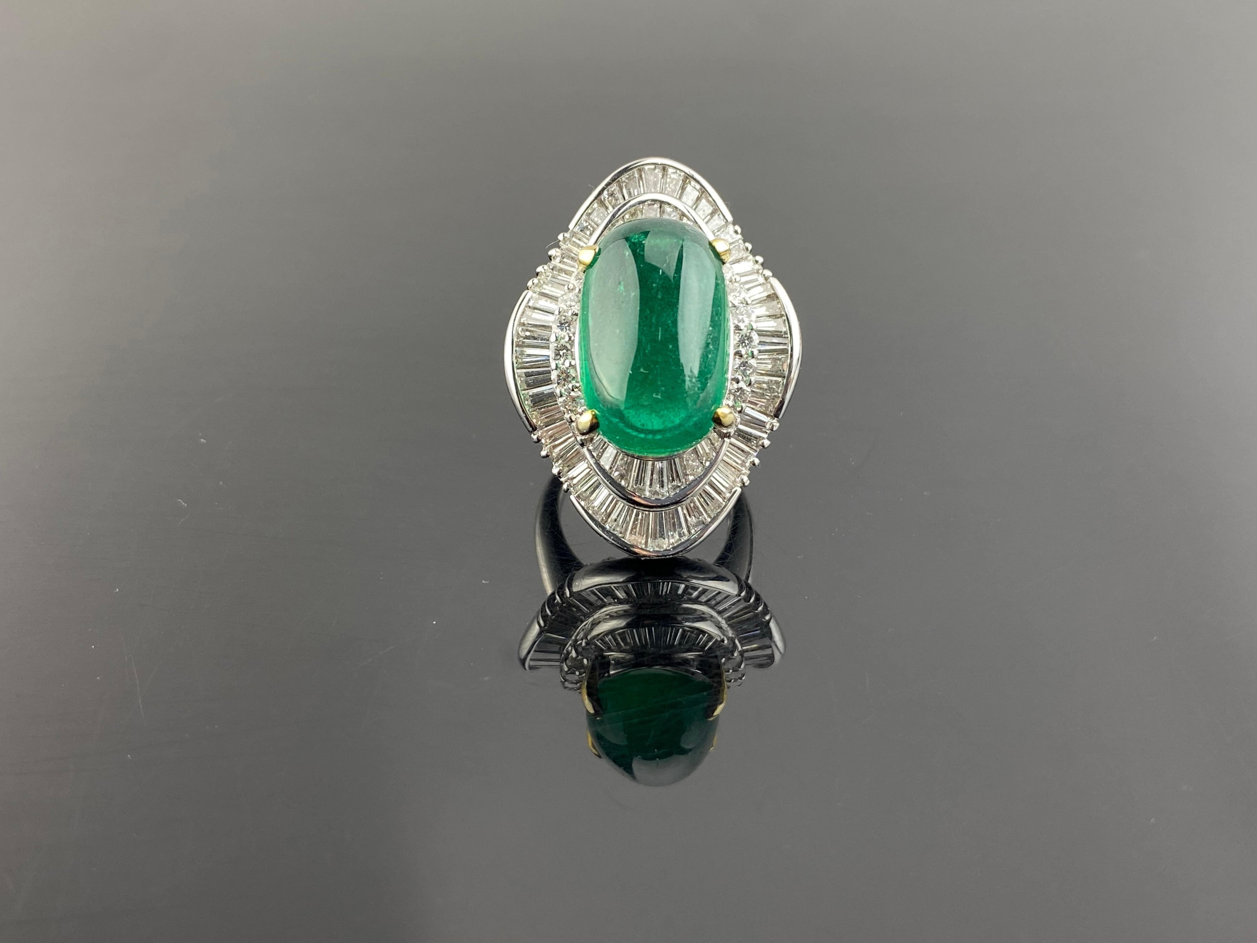 A beautiful, eye-catching 17.93 carat Zambian Emerald cabochon center stone, surrounded with 4.31 carat VVS quality White Diamond - all set in platinum. The Emerald has a great vivid green color, and is absolutely transparent with a stunning