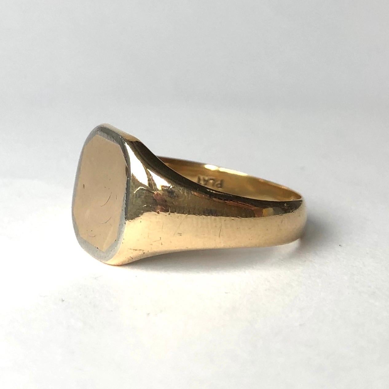 This unusual signet ring is made by Henry Griffith & Sons, made in Leamington Spa with Chester assay marks. The ring is modelled in 18ct carat gold and the face of the ring is framed with platinum. 

Face Dimensions: S or 9 

Weight: 7.86g