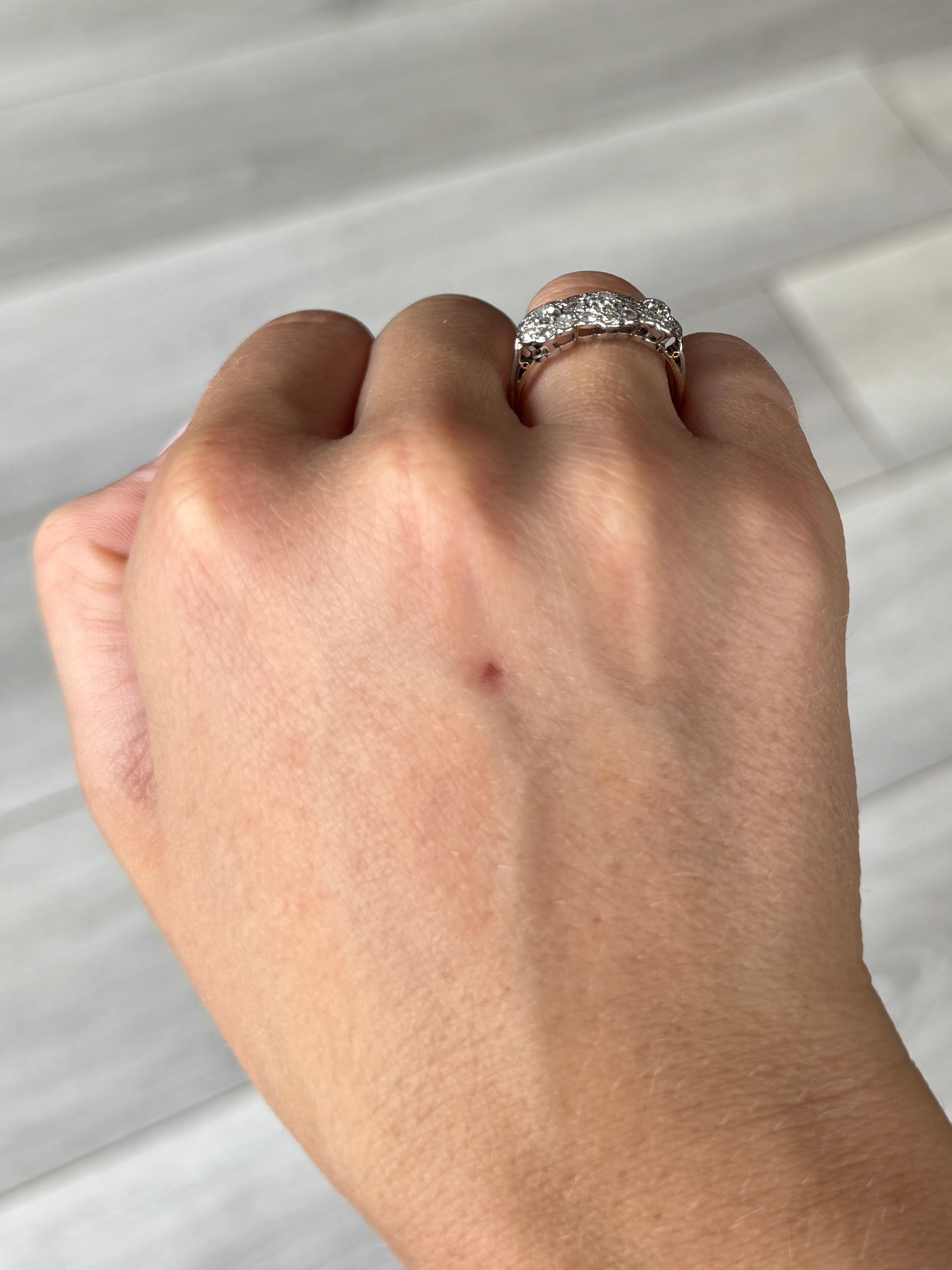 This gorgeous triple cluster is super sparkly. It holds a total of 1.10 carat worth of diamonds. The ring is modelled in 18 carat yellow gold and the stones are set in platinum. 

Ring Size O or 7 
Cluster Dimensions: 19x9mm
Height Off Finger: