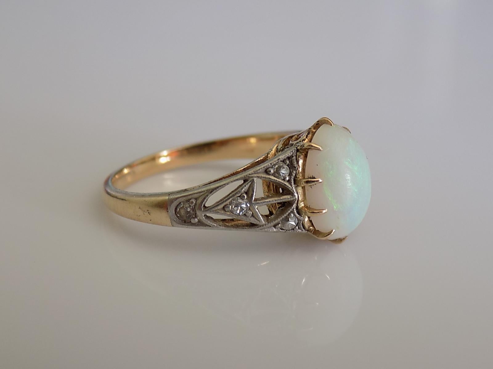 A Gorgeous Art Deco c.1920s/30s 18 Carat Gold, Australian Opal and Diamond dress ring. 

Size J UK, 5 US can be sized.

Opal 10mm x 7mm.
Unmarked, tested 18 Carat Gold.

The ring in excellent condition for the age, the stones without any damage and