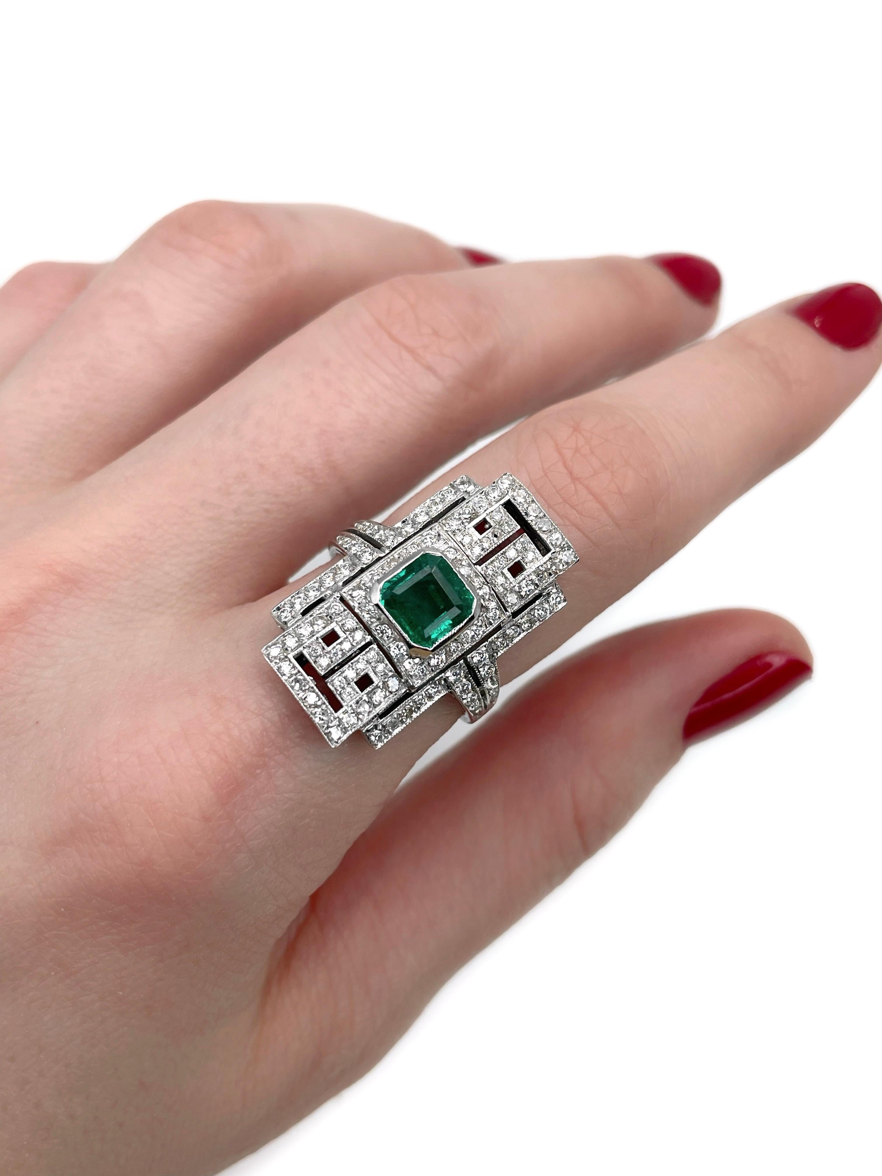 This is an Art Deco cocktail ring crafted in 18K white gold. Circa 1940. 

The piece features:
- 1 emerald, emerald cut, 1.20ct, vslbG 5/4, P1
- 72 diamonds, round brilliant cut, TW 0.45ct, RW+/W, VS-SI
- 25 diamonds, RBC-17, TW 0.18ct, RW-T,