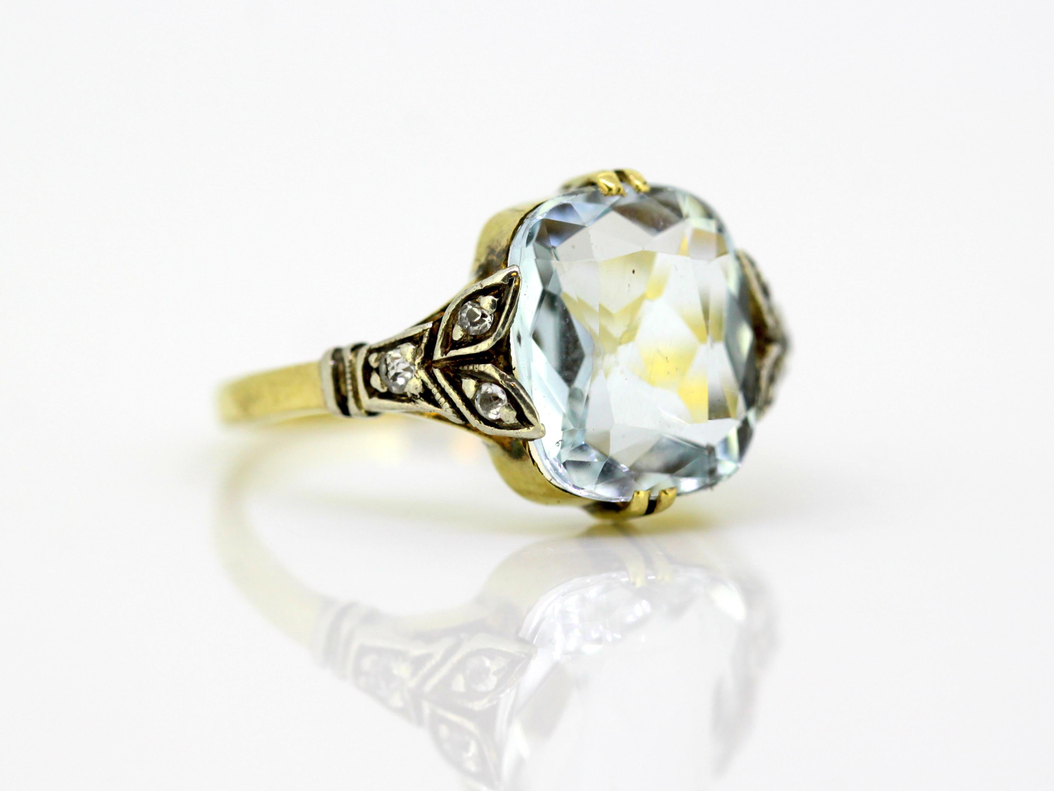 Art Deco 18k yellow gold ladies ring with aquamarine and diamonds 
Made in England, Circa 1920's 

Dimensions - 
Finger Size: (UK) = L (US) = 6 (EU) = 51 1/2 
Ring Size : 2.2 x 1.95 x 1.2 cm 
Weight : 3 grams 

Aquamarine - 
Cut : Cushion 
Approx