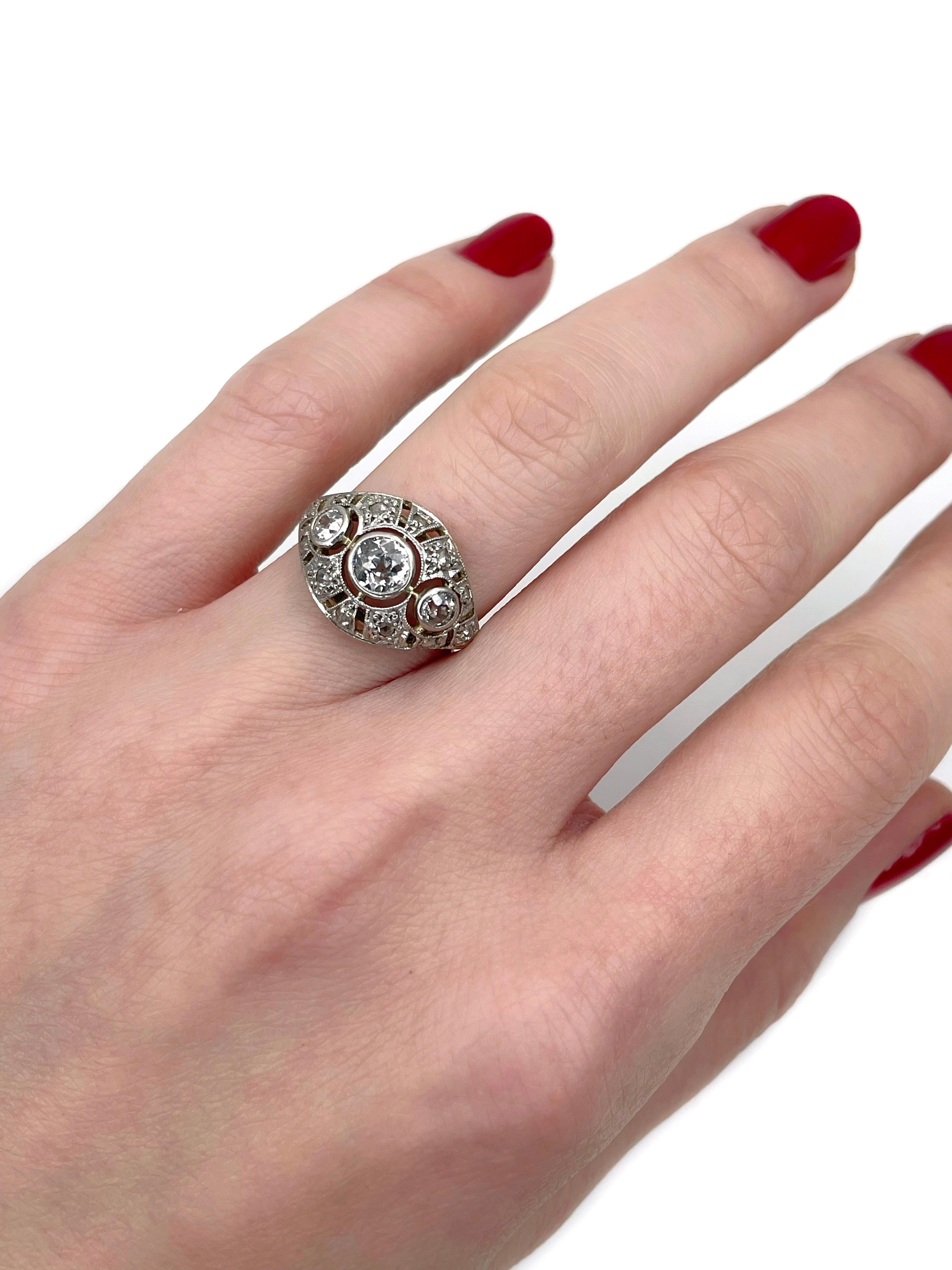 This is an Art Deco openwork cocktail ring crafted in 14K gold and 950 platinum. Circa 1930. 

The piece features diamonds (TW 0.86ct):
- 3 diamonds (old European cut, TW 0.75ct, STW, SI-P1)
- 12 diamonds (rose cut, TW 0.11ct, RW-W, SI)

Weight: