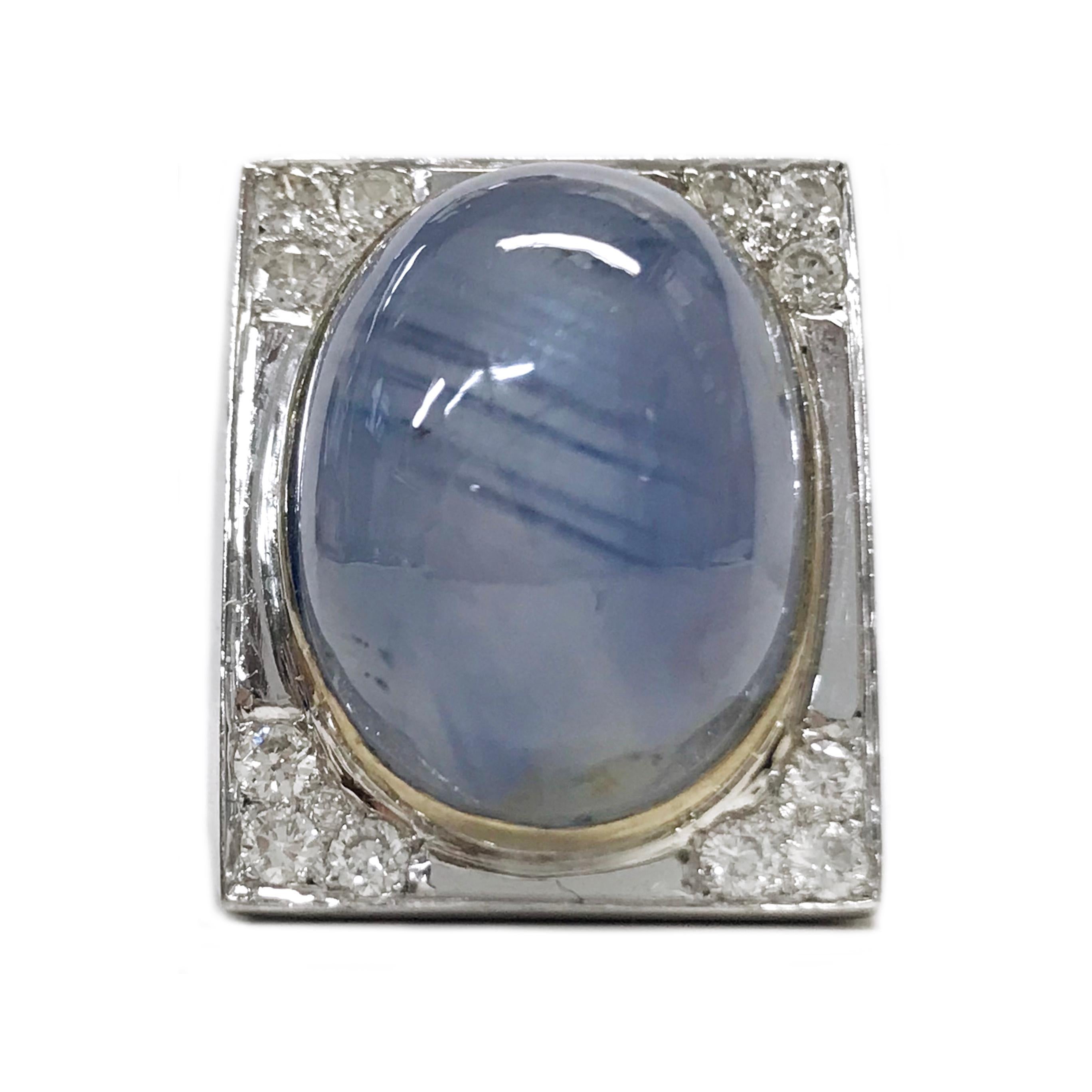 Art Deco 18 Karat White Gold Star Sapphire Diamond Ring, 20.04tcw. The ring features a large bezel-set oval cabochon natural star sapphire measuring 20 x 16 x 13mm. The star has a good presence with light (See the last photo). Three single-cut