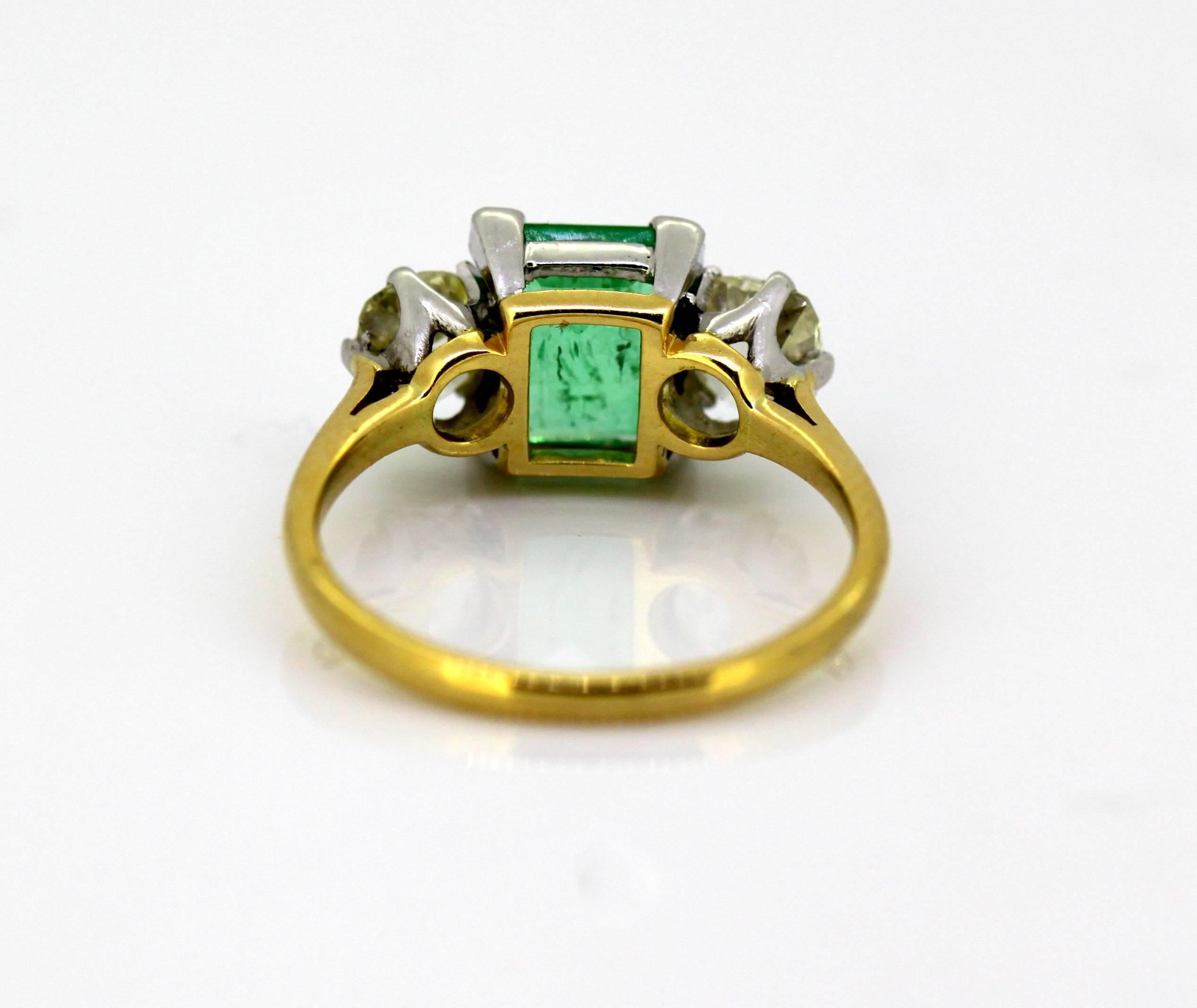Women's Art Deco 18 Karat Gold Three-Stone Ladies Ring with Emerald and Diamonds