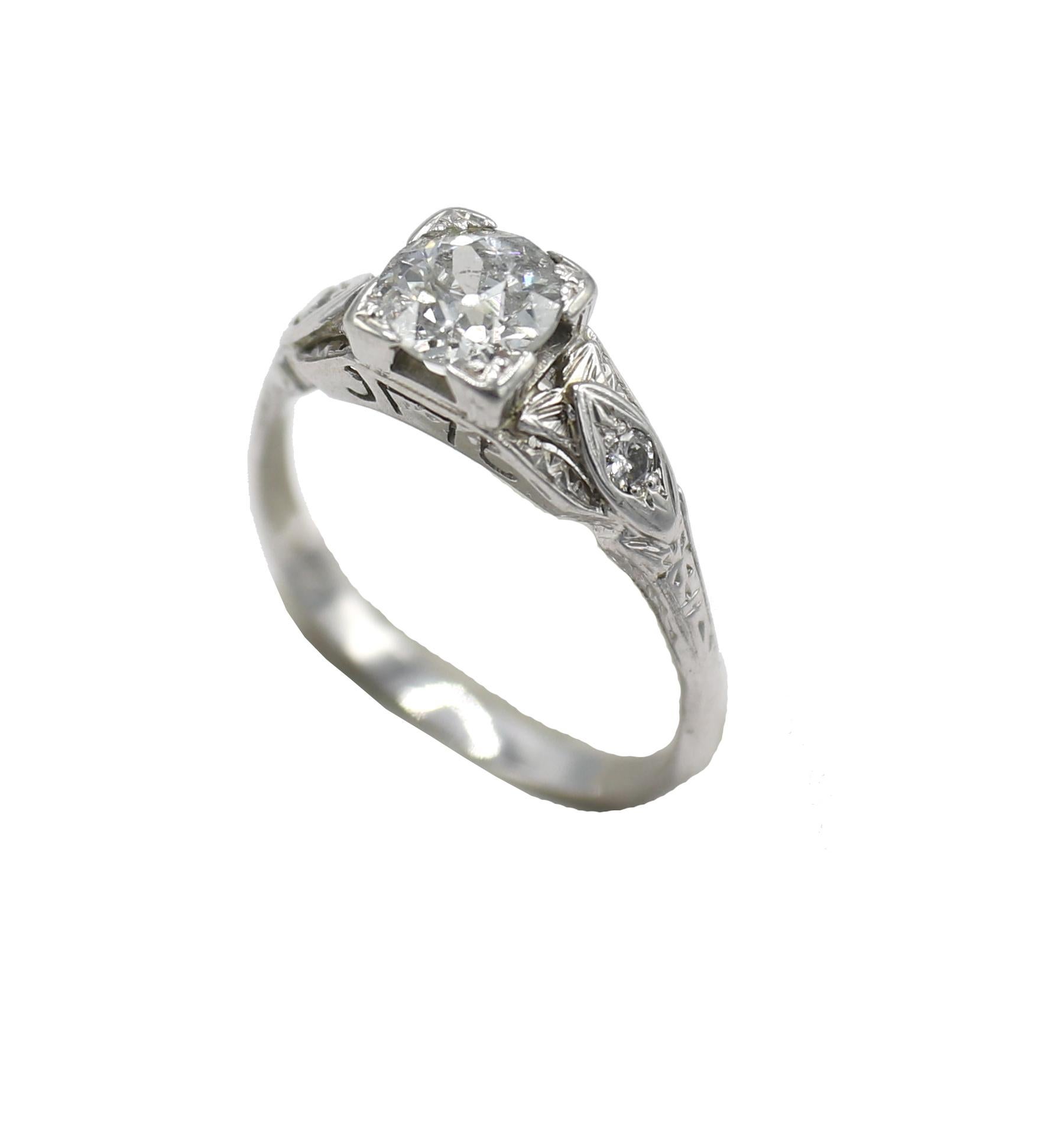 Art Deco 18 Karat White Gold Old European Cut Natural Diamond Engagement Ring 
Metal: 18k white gold
Weight: 3.17 grams
Diamond: Approx. .95 carat J I1 natural diamond
Accent diamonds: Approx. .10 CTW J SI natural diamonds
Size: 8.5 (US)
Height: 6mm
