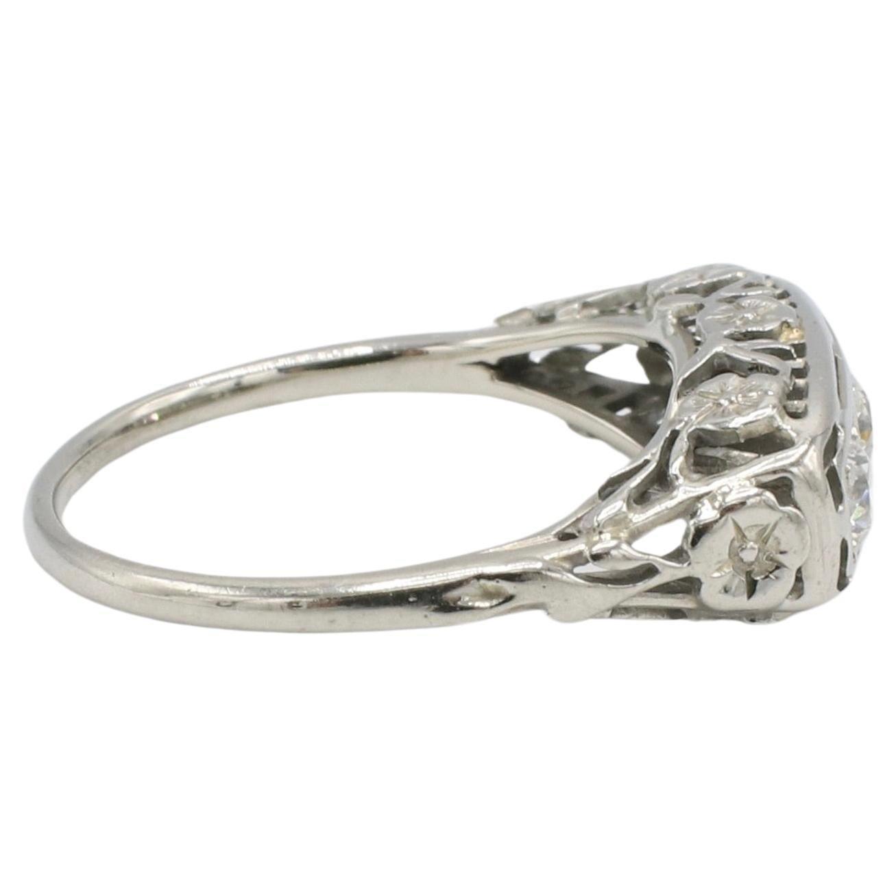 Art Deco 18 Karat White Gold Old European Cut Natural Diamond Three-Stone Ring 
Metal: 18k white gold
Weight: 3.17 grams
Diamonds: 3 old European cut natural diamonds .40 CTW F-G VS
Size: 6.5 (US)
Height: 4.7mm
Width: 7.3mm
