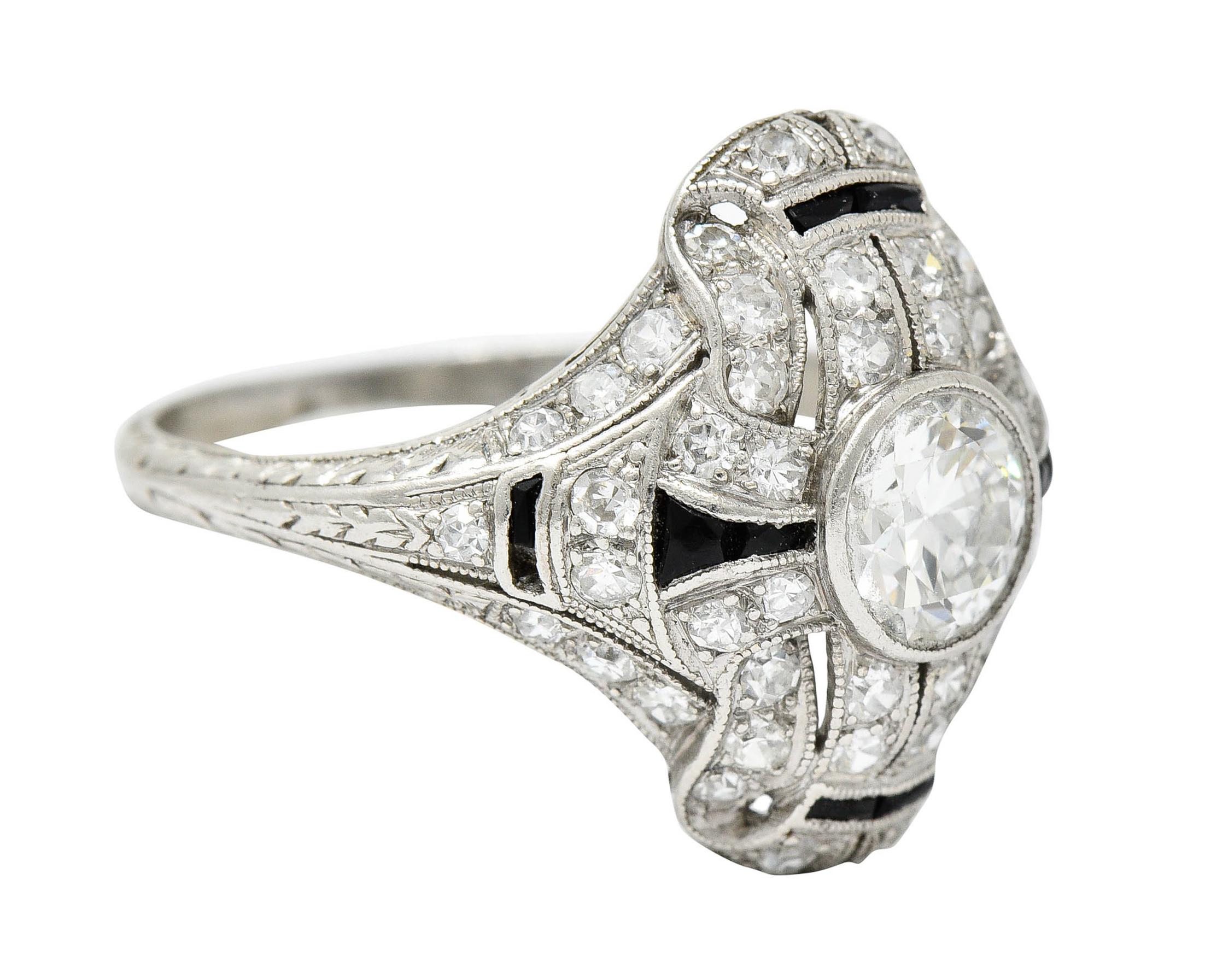 Centering a transitional cut diamond weighing approximately 0.80 carat - J color with VS clarity

Bezel set in a dinner style ring accented by calibrè cut onyx

Set throughout by single cut diamonds weighing in total approximately 1.00 carat - G to