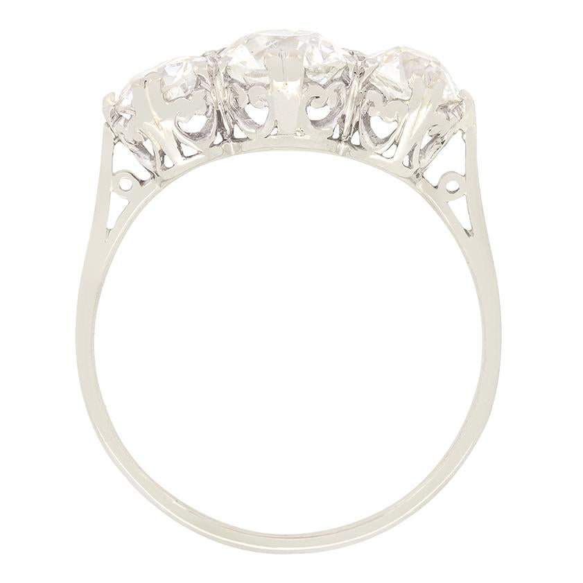 This classic Art Deco three stone ring beautifully showcases a trio of old cut diamonds. The central diamonds is the largest, at 1.00 carat with the flanking pair weighing 0.40 carat a piece. All three diamonds range in colour from G to H and in