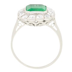 Art Deco 1.80ct Emerald and Diamond Halo Cluster Ring, c.1920s