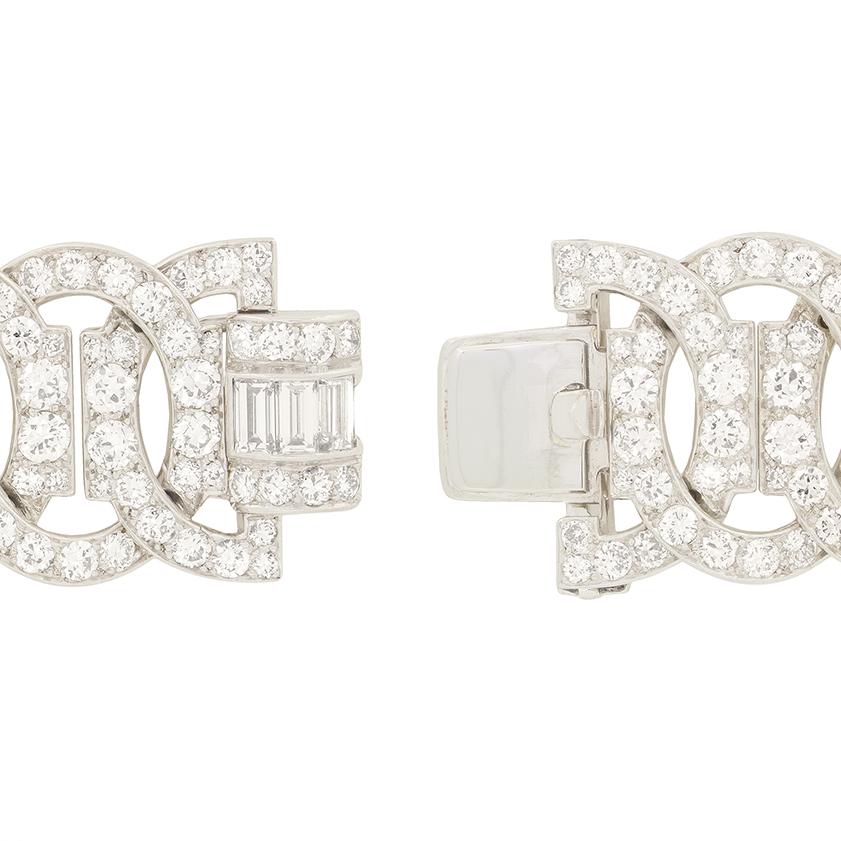 This Art Deco diamond bracelet exudes the luxurious feel of the era with its bold geometric design and luxurious sparkle. The intricate composition features interlocking links fully encrusted with old cut diamonds, totalling an impressive 16.10