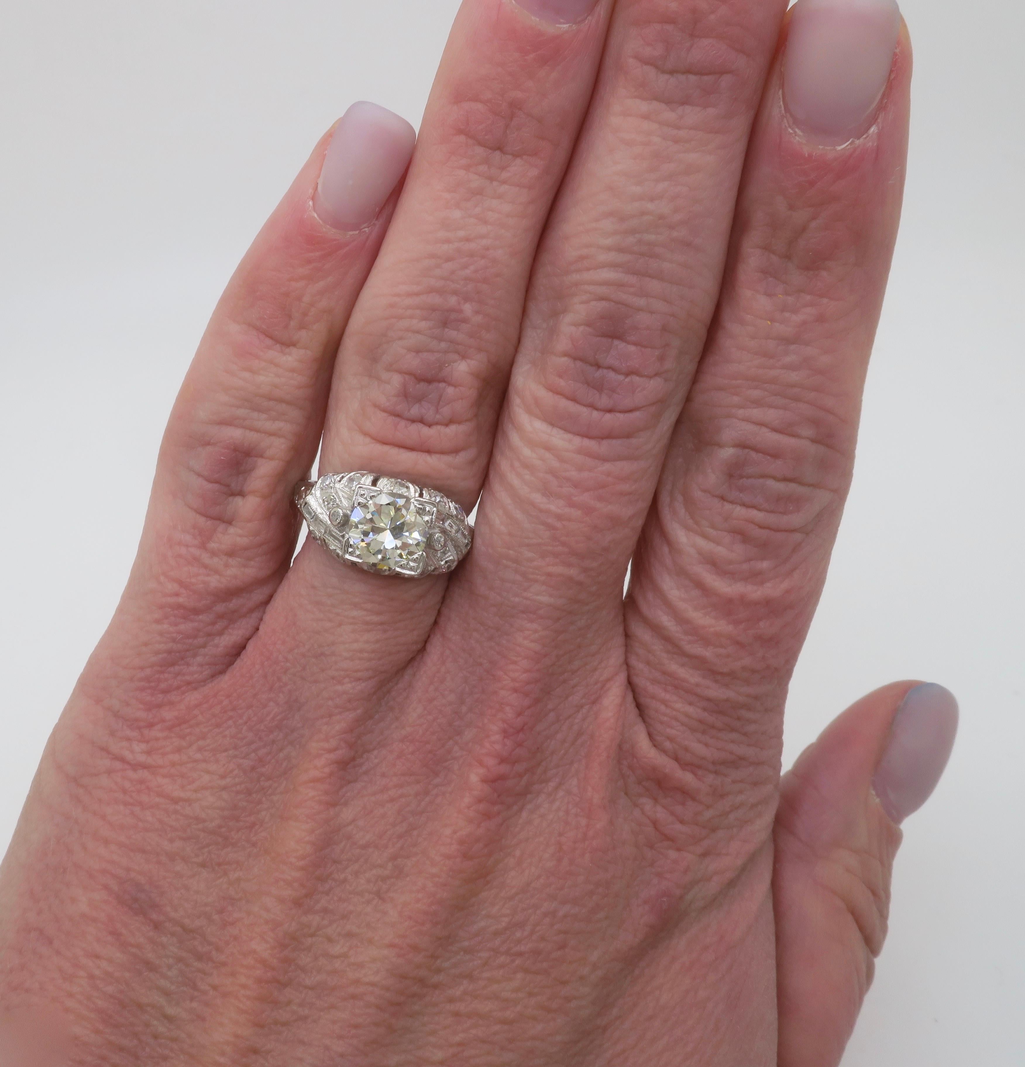 Beautiful Art Deco Platinum diamond ring with 1.82CTW of diamonds. 

Center Diamond Carat Weight: 1.42CT Earth Mined
Center Diamond Cut: Transitional Round Cut 
Center Diamond Color: L
Center Diamond Clarity: VS1
Total Diamond Carat Weight: