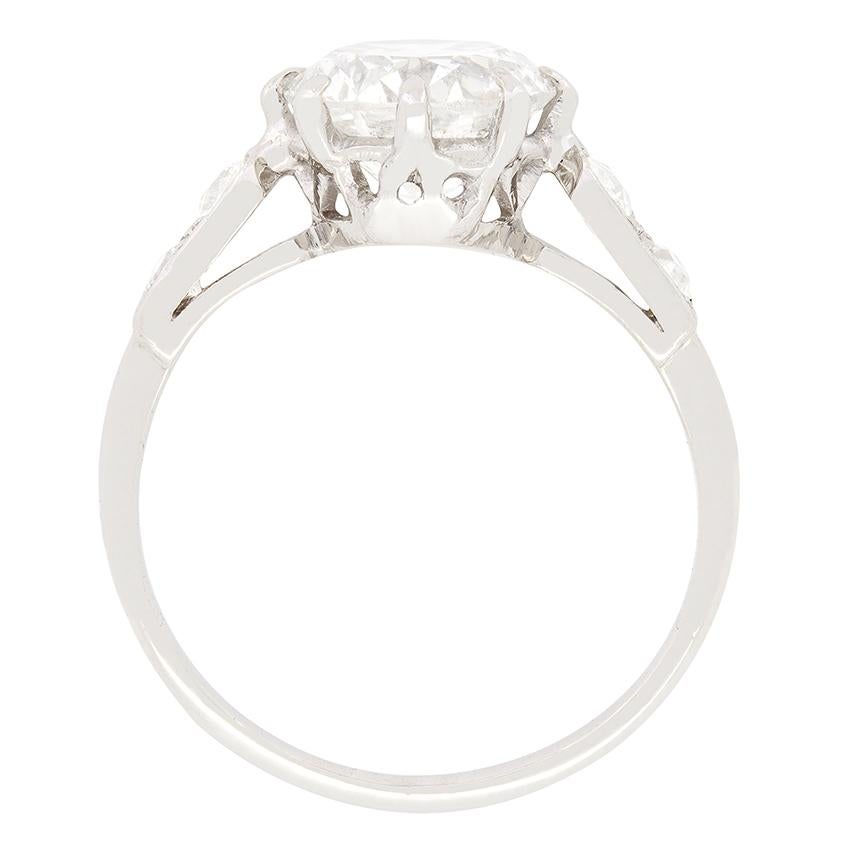 This Art Deco solitaire ring features a beautiful 1.85 carat, transitional cut diamond as the centre piece. The diamond is claw set and has been given a grading of G to H in colour and SI2 in clarity. The ring has been crafted from platinum and has