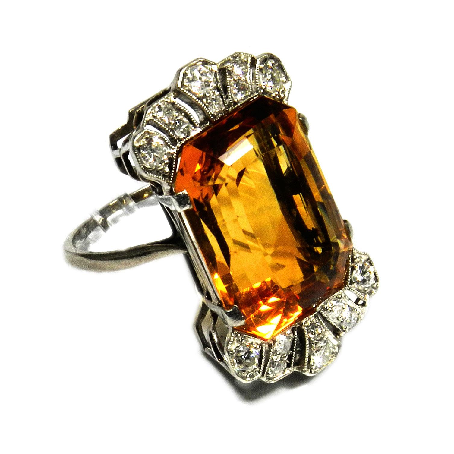 Art Deco 18.7 Carat Citrine Diamond Cocktail Ring in 18K White Gold, circa 1930

Elegant cocktail ring with a lattice-shaped openwork ring head, set with a magnificent cognac-colored  18.7 carat citrine, crowned by diamonds totaling 0.5 carat

