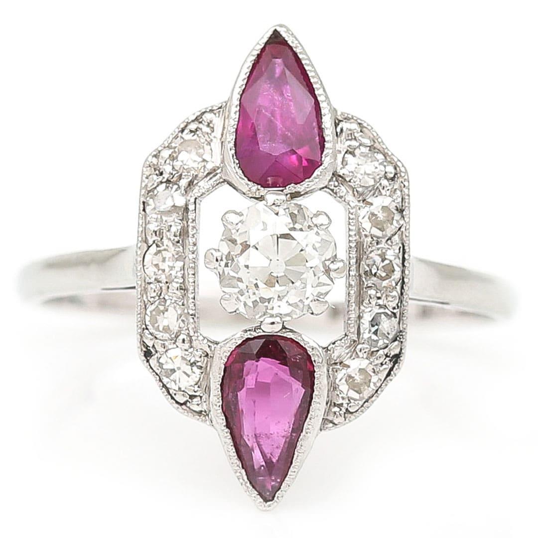 A fabulous Art Deco 18ct white gold and platinum pear cut ruby and old cut diamond ring, masterfully crafted circa 1920. The stunning and totally unique design of this ring has all the typical styling of the Deco period - geometry, setting and