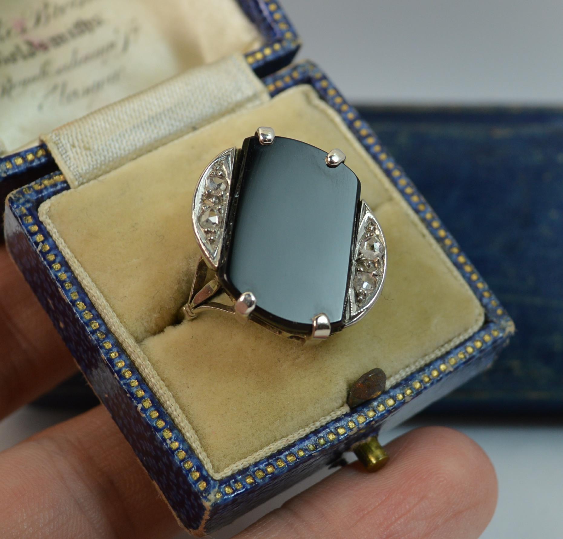 A fantastic Art Deco period panel or slab ring c1920.
SIZE ; Q UK, 8 1/4 US
Solid 18 carat white gold example.

Oval head to measure 16mm x 20mm approx. Four claw set onyx on a diagonal with two natural rose cut diamonds above and below.


CONDITION