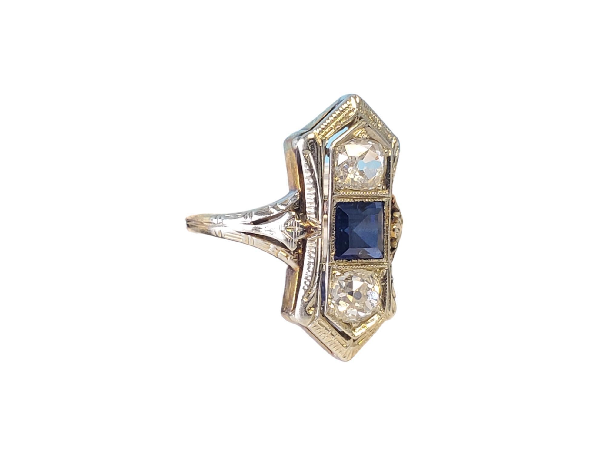 Art Deco 3 Stone Diamond and Sapphire Ring

Listed is a deco 3 stone old euro ring with blue sapphire in the center. The sapphire appears to be synthetic flanked by .33ct each G-I color old cut diamonds that are eye clean and white The ring has a