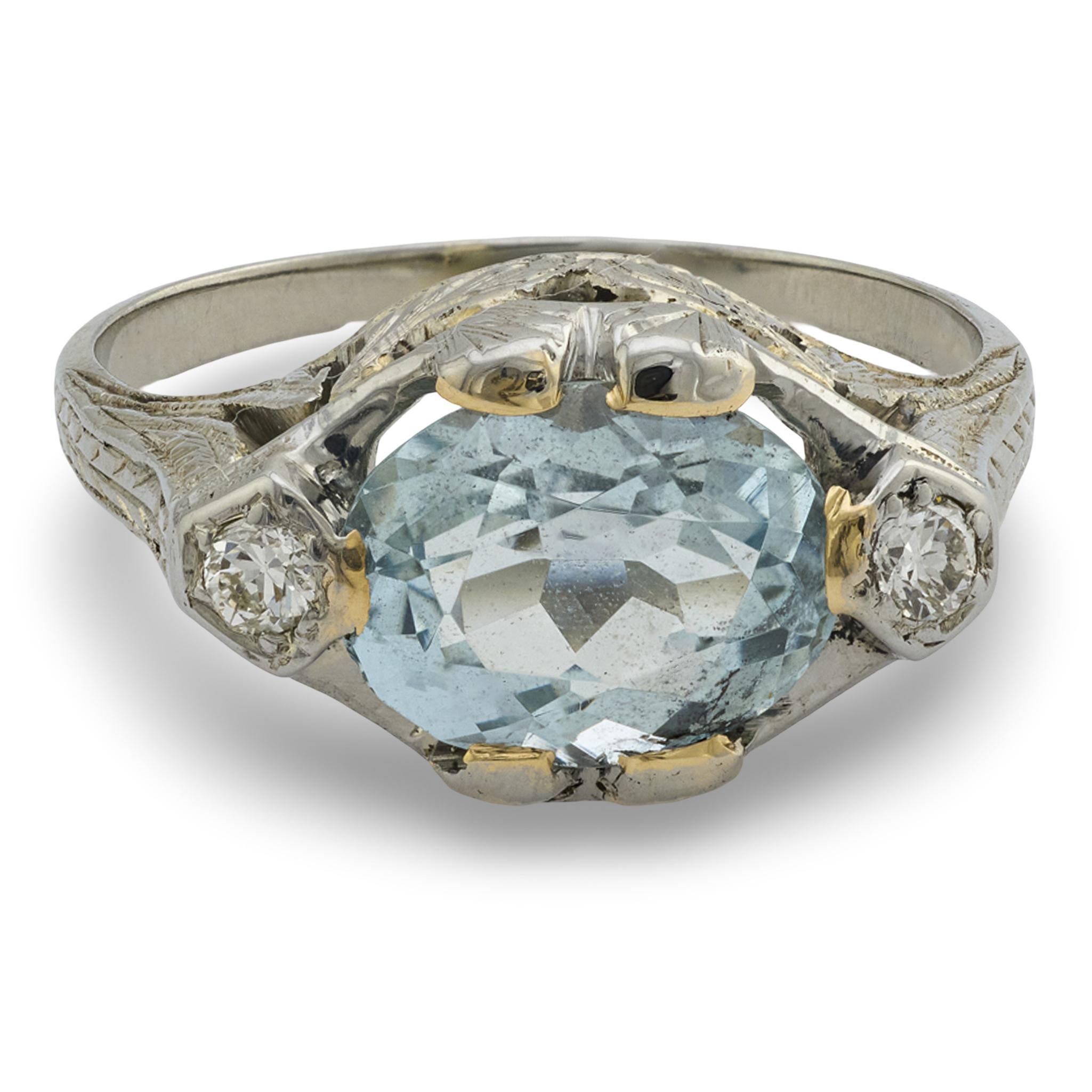 A beautiful aquamarine ring from the Art Deco (ca1920s) era! Crafted in 18k white gold, this ring features a 2.25ct oval cut aqua, which is held within a four-prong setting and displays a lovely light-blue hue. The aqua is complimented on both sides