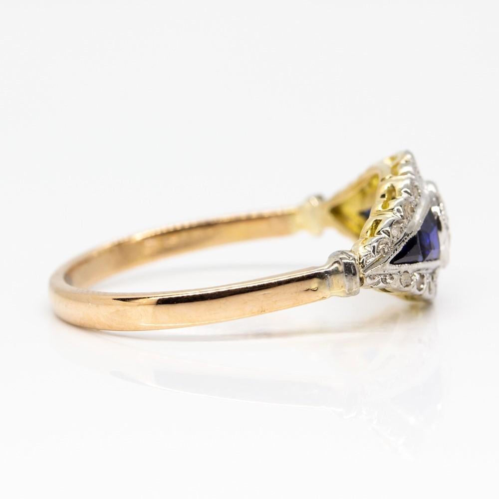 Crafted in 18k gold and platinum, this stunning ring is centered with 1 prominent old mine cut diamond of H-VS2 quality that weighs 0.30ctw.
The central glowing stone shows 2 natural calibrated cut sapphires at both sides that weigh 0.10ctw.