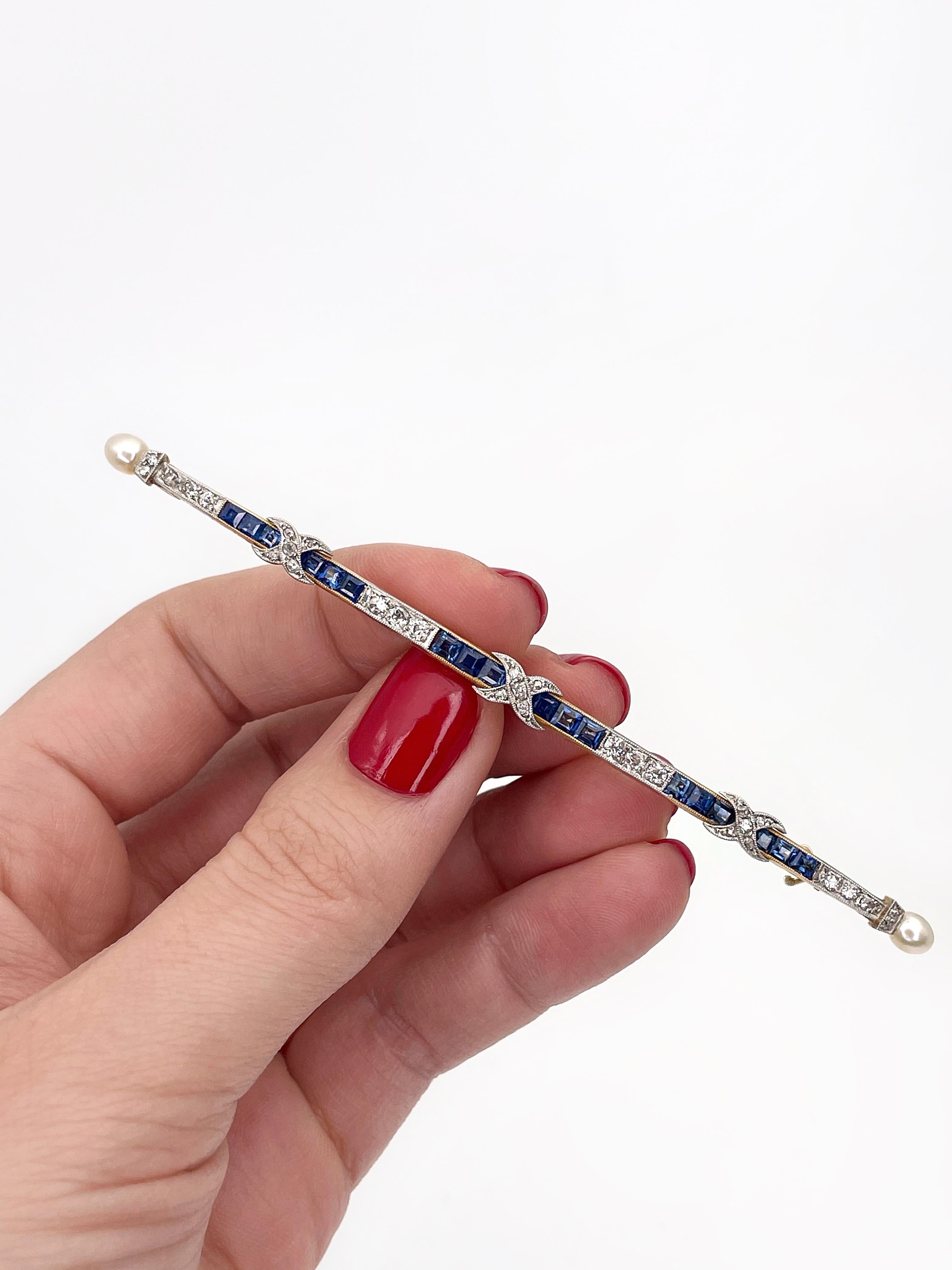 This is an Art Deco long bar brooch crafted in 18K gold and adorned with 900 hallmark platinum. The piece features 18 square cut blue sapphires (1.70ct, vB 7/2 7/4, VS-SI). 

The gems are paired with diamonds: 
-16pcs., old cut, 0.43ct, W-STW,