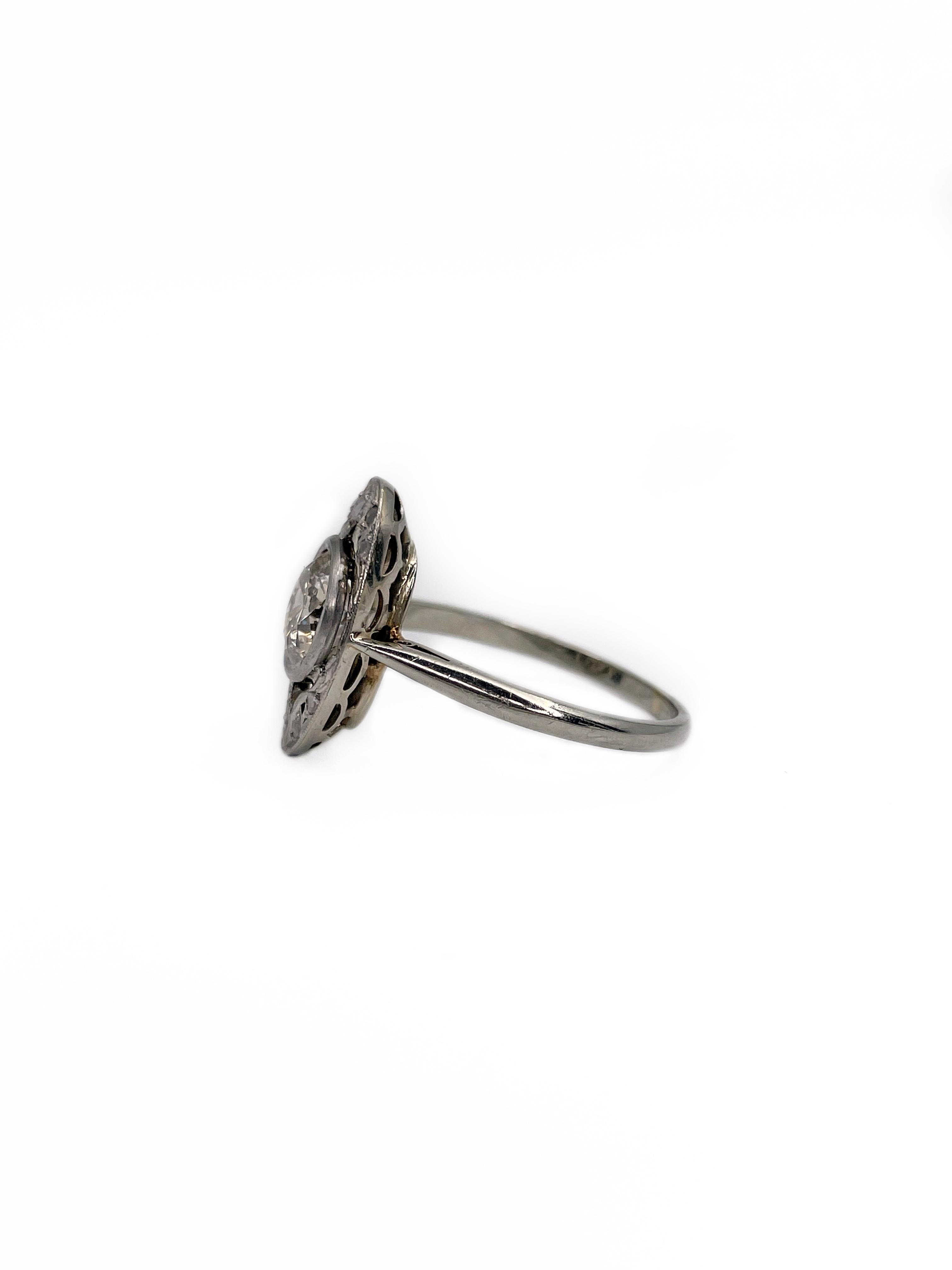 This is a typical Art Deco period oval ring crafted in 950 hallmark platinum. The head itself is strengthened with metal. Central stone is 1.00ct old brilliant cut diamond, which colour is Tinted and clarity - P2. It is accompanied with 6 rose cut