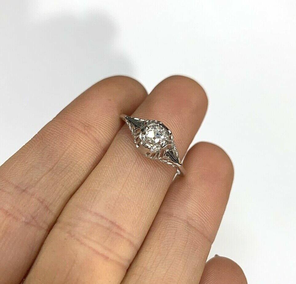 Presenting a 

Art Deco 18K White Gold .52CT French Mine Cut Diamond Ring Size 6.25

Featuring a lovely art deco ring centered with a diamond of .52 carats.

The diamond has a high dome, and is not quite french cut, but has a gorgeous angular old