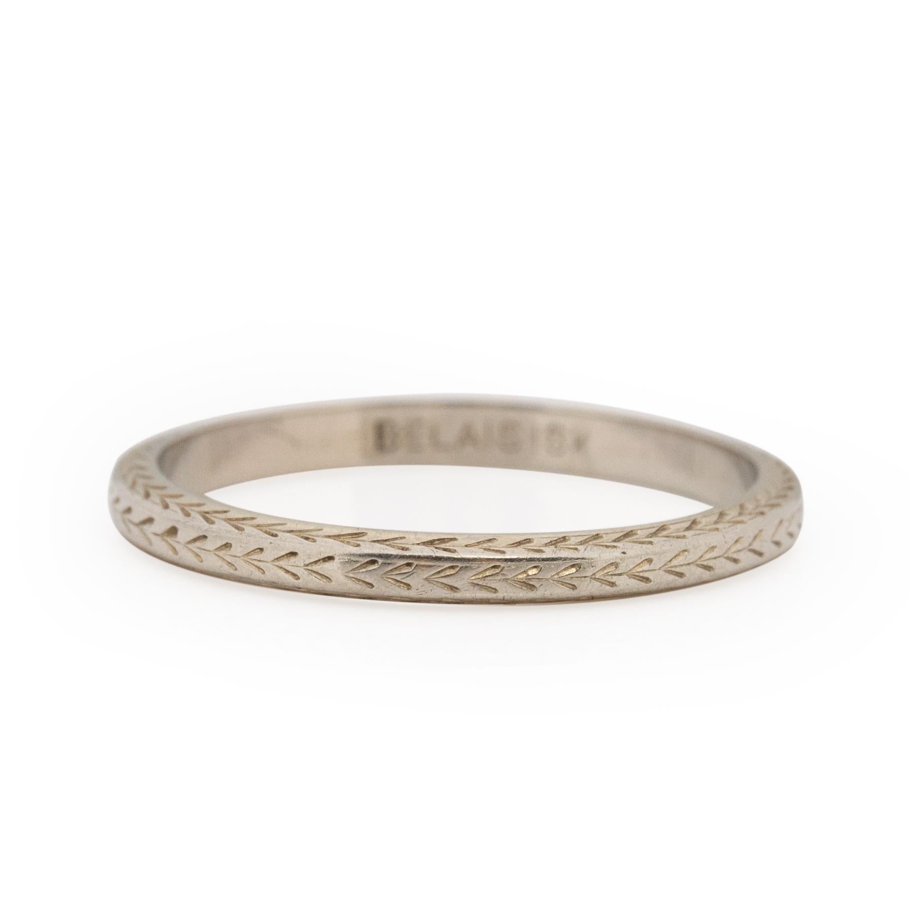 This signed Belais Bros beauty is a classic Belais design. Popular in the 1920's this 18K white gold band has three sides that are carved with a chevron design. The delicate details are visible at every turn. The repeating chevron pattern is simple,