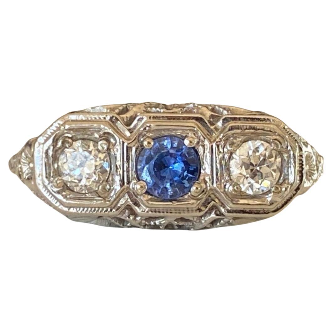 Art Deco 18K White Gold Blue Sapphire and Diamond Three-Stone Ring For Sale