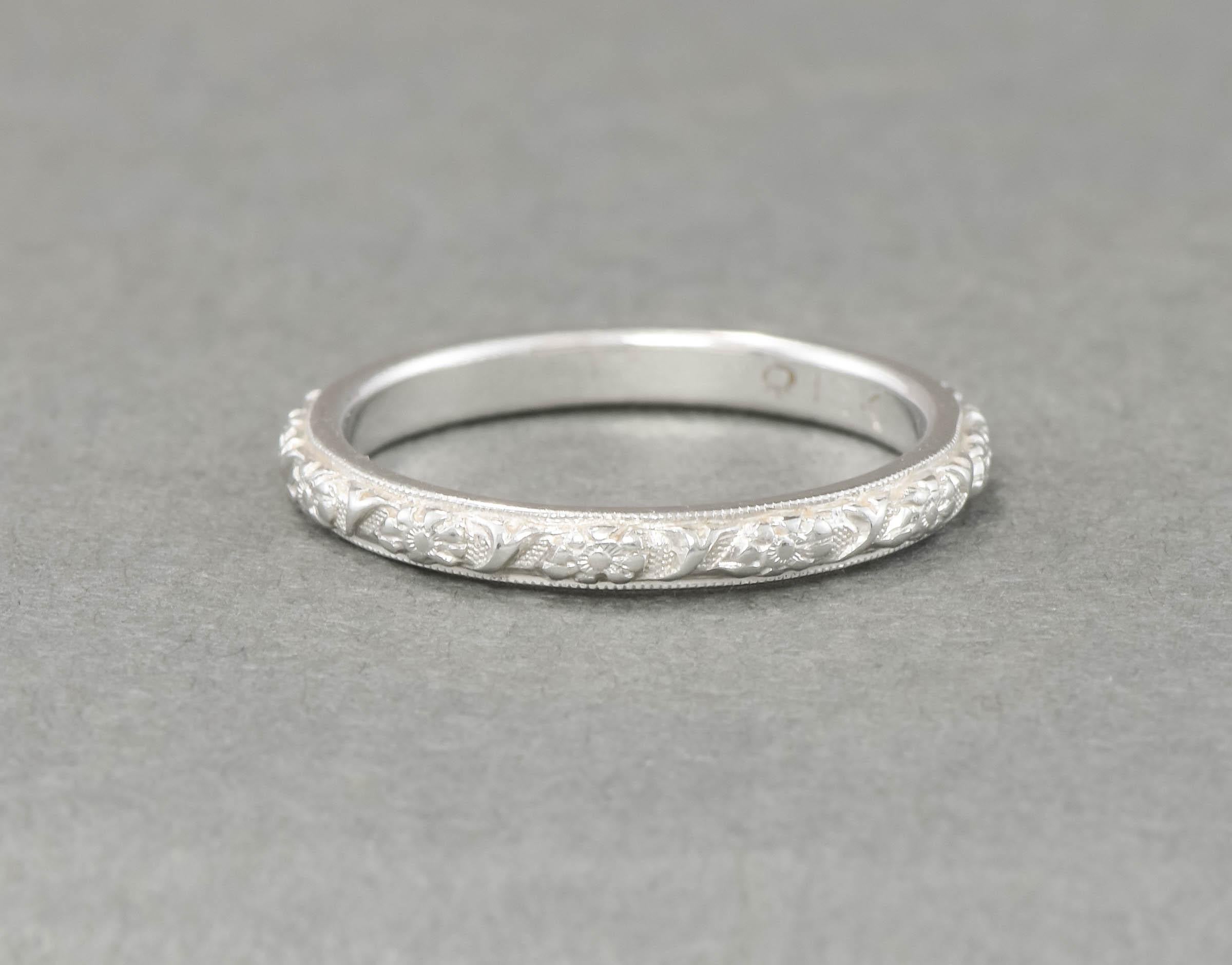 It's so hard to find Art Deco era wedding bands in such amazing condition - especially those that have the wonderful carved floral designs so coveted from this period.

Measuring approximately 2.3 mm in width, with a rise/thickness of approximately