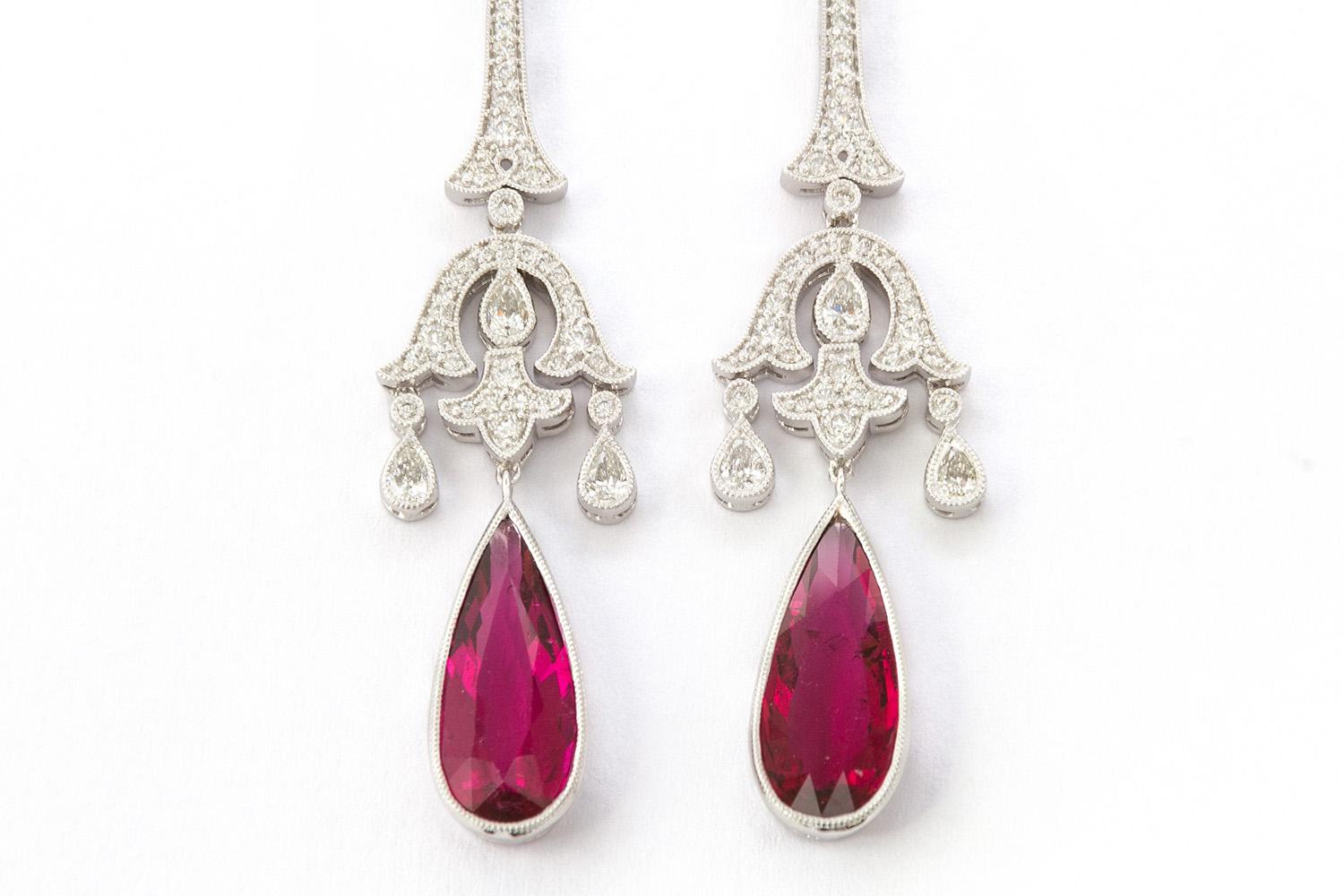 We are pleased to offer these Art Deco style 18k White Gold Rubellite & Diamond Dangle Drop Earrings. These stunning earrings are modern vintage reproduction inspired by the Art Deco era. They feature 6.98ctw pear shaped natural rubellite stones