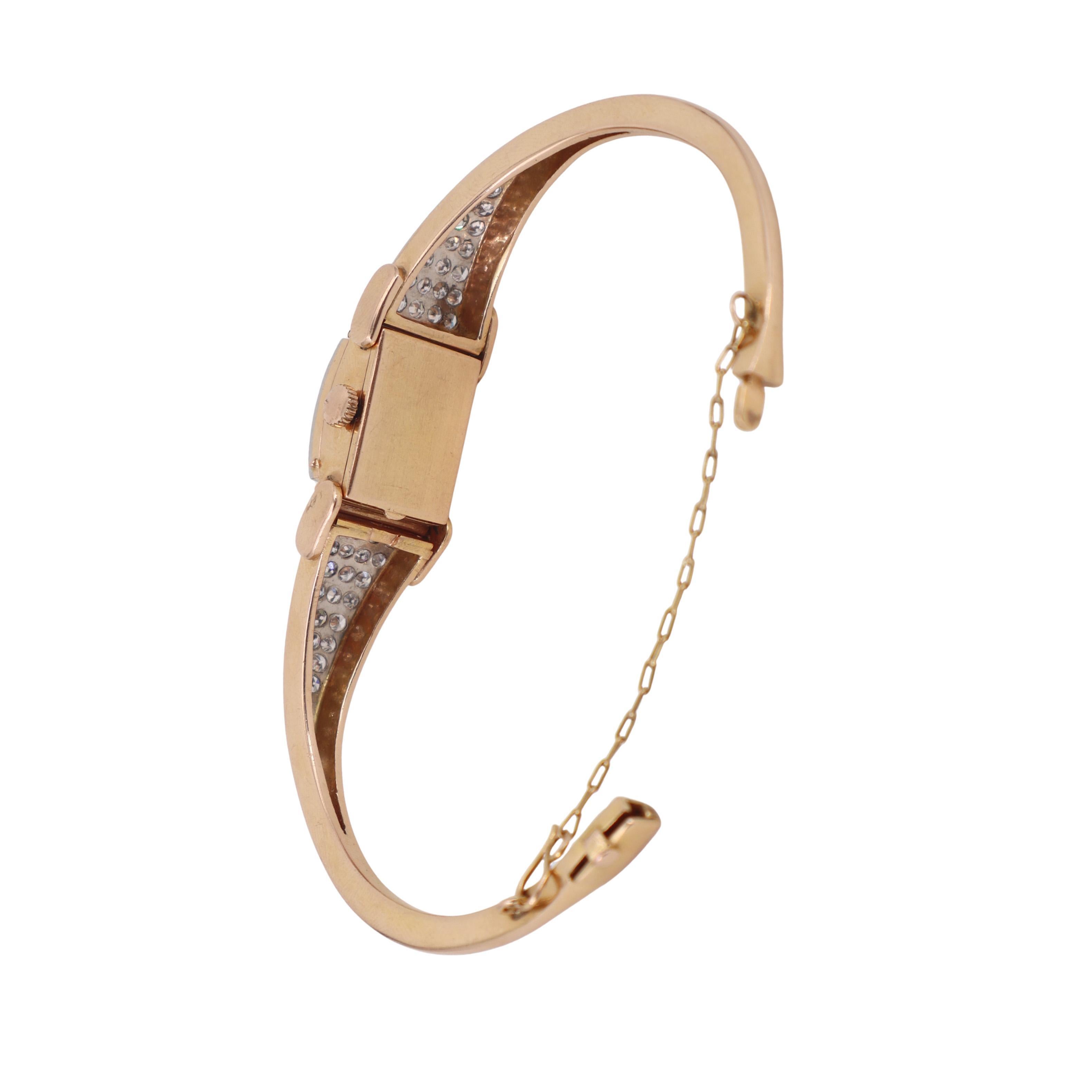 Art Deco 18kt Gold Bangle Universal Geneve Watch with 4.40 CTW in Diamonds Bon état - En vente à Aventura, FL