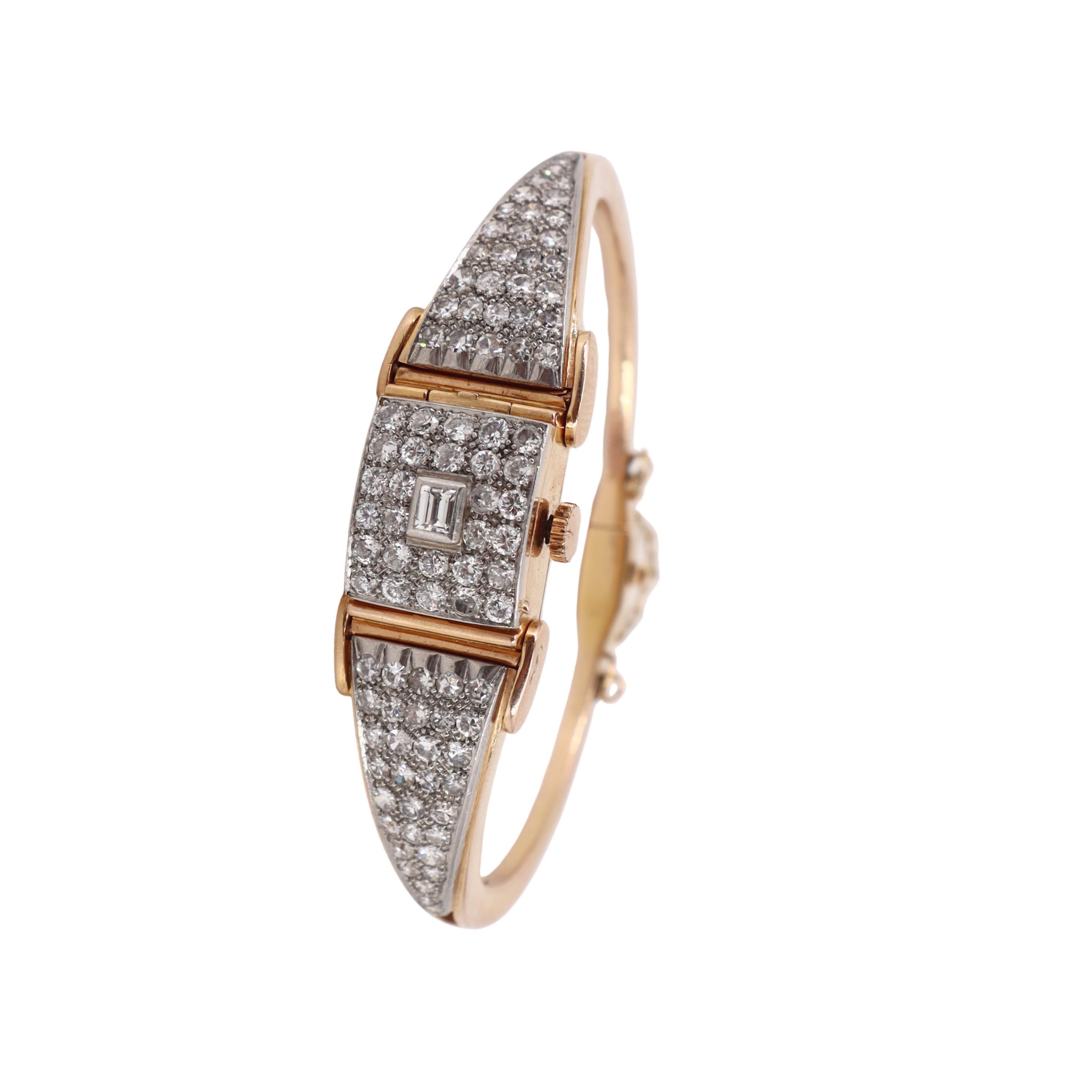 Art Deco 18kt Gold Bangle Universal Geneve Watch with 4.40 CTW in Diamonds en vente