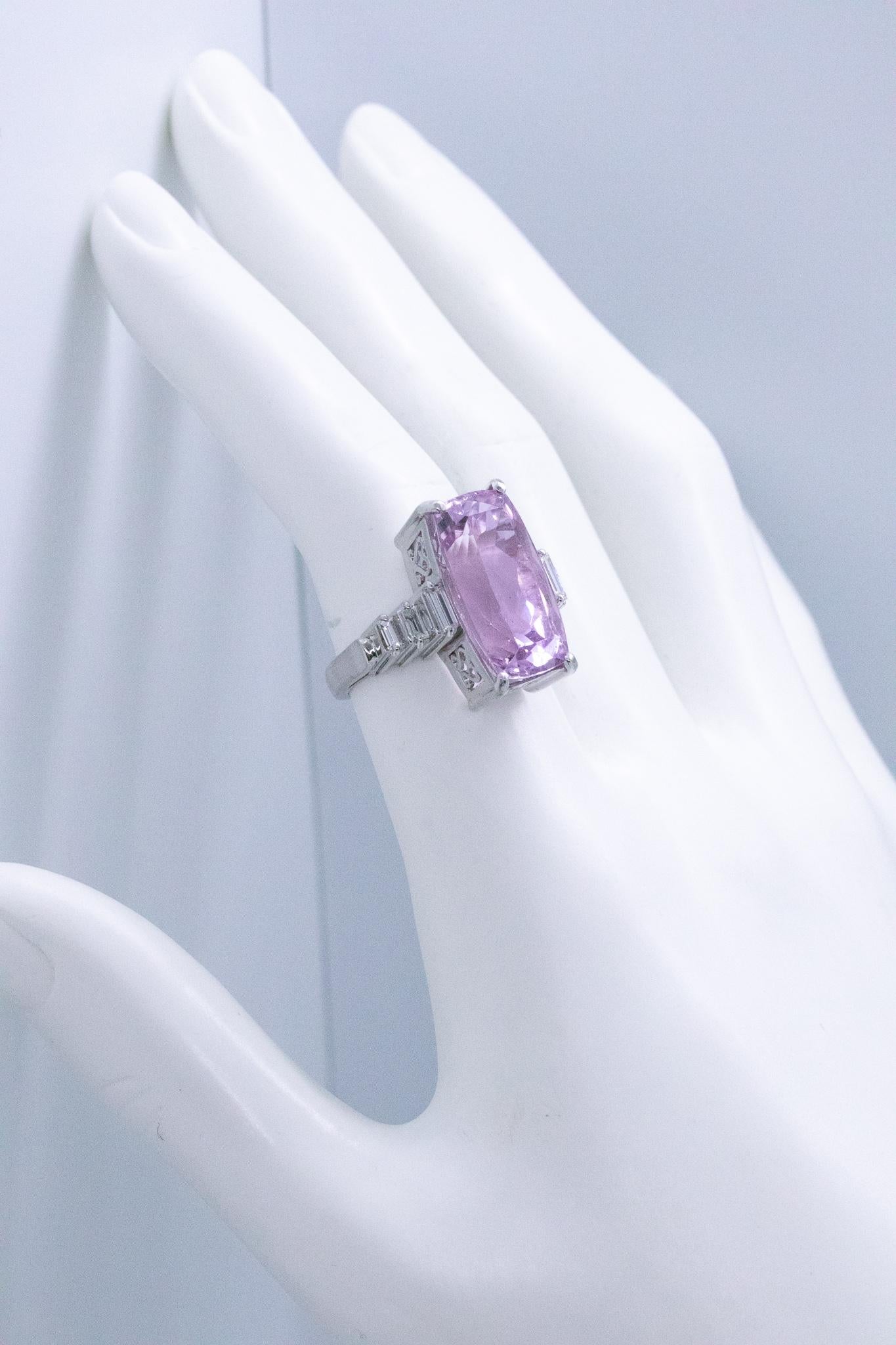 Art-deco sky scraper ring.

Beautiful geometric piece made at the end of the American art deco, circa 1940. It was crafted with sky-crappers patterns in solid 18 karats white gold.

Prong set in the center, with one natural purplish kunzite